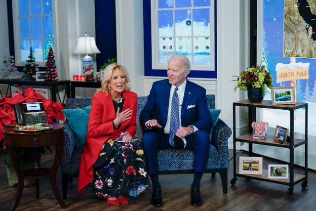 <p>President Joe Biden and first lady Jill Biden speak with the NORAD Tracks Santa Operations Center on Peterson Air Force Base, Colo., via teleconference in the South Court Auditorium on the White House campus in Washington, Friday, Dec. 24, 2021.  (AP Photo/Carolyn Kaster)</p>
