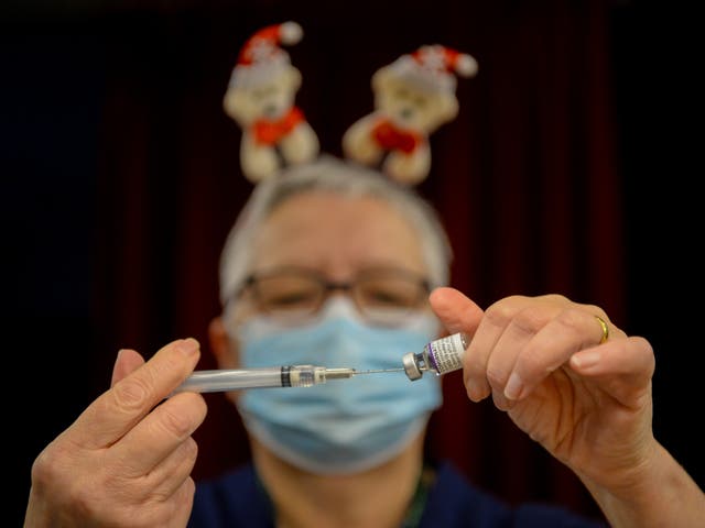 <p>A Covid vaccine is prepared at a walk-in centre in Dorset</p>