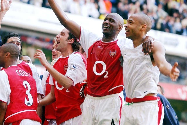 Patrick Vieira (second right) helped Arsenal clinch the title at Tottenham (Sean Dempsey/PA)