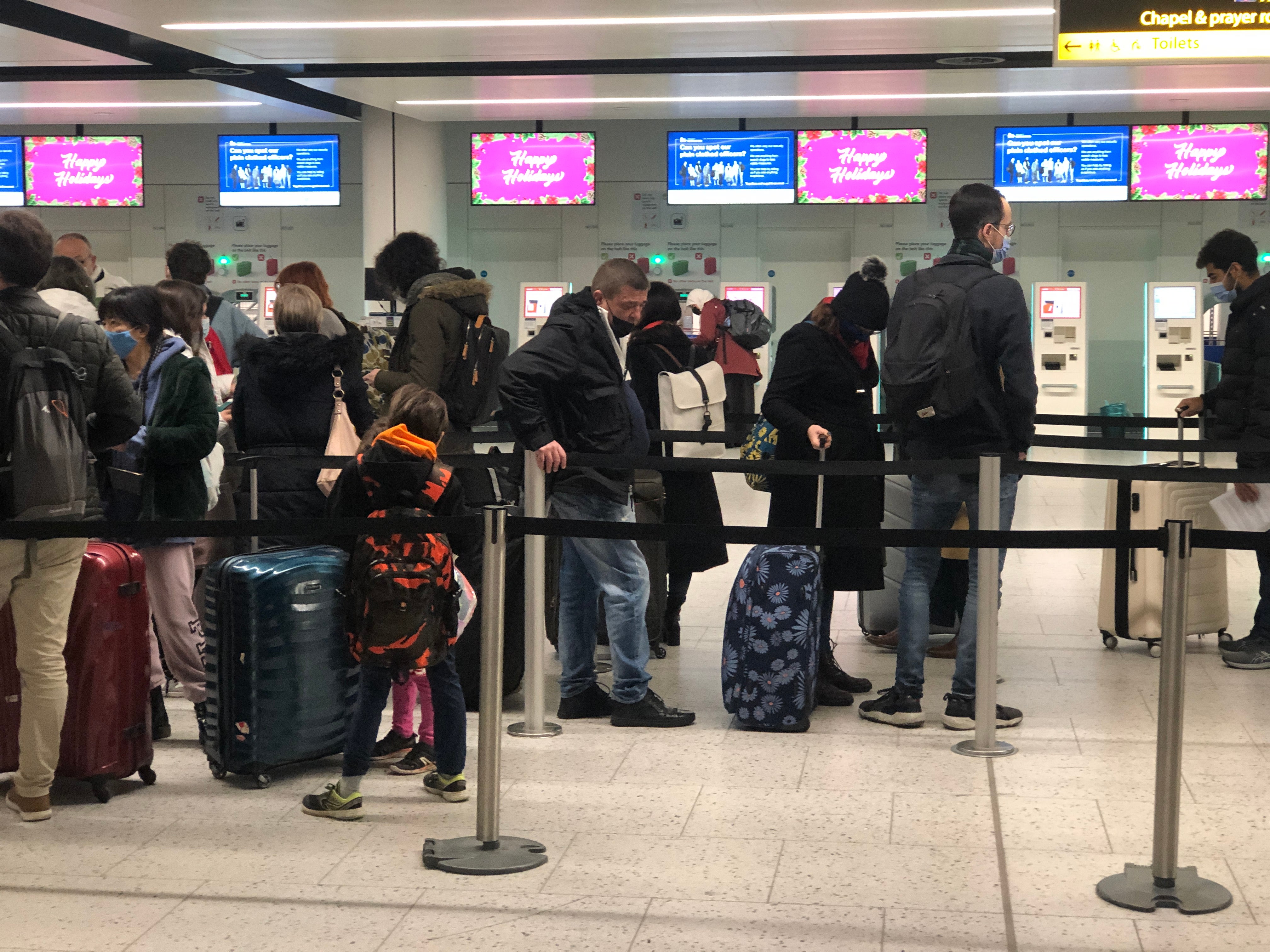 Any chance of a sit-down? Passengers queue at Gatwick airport