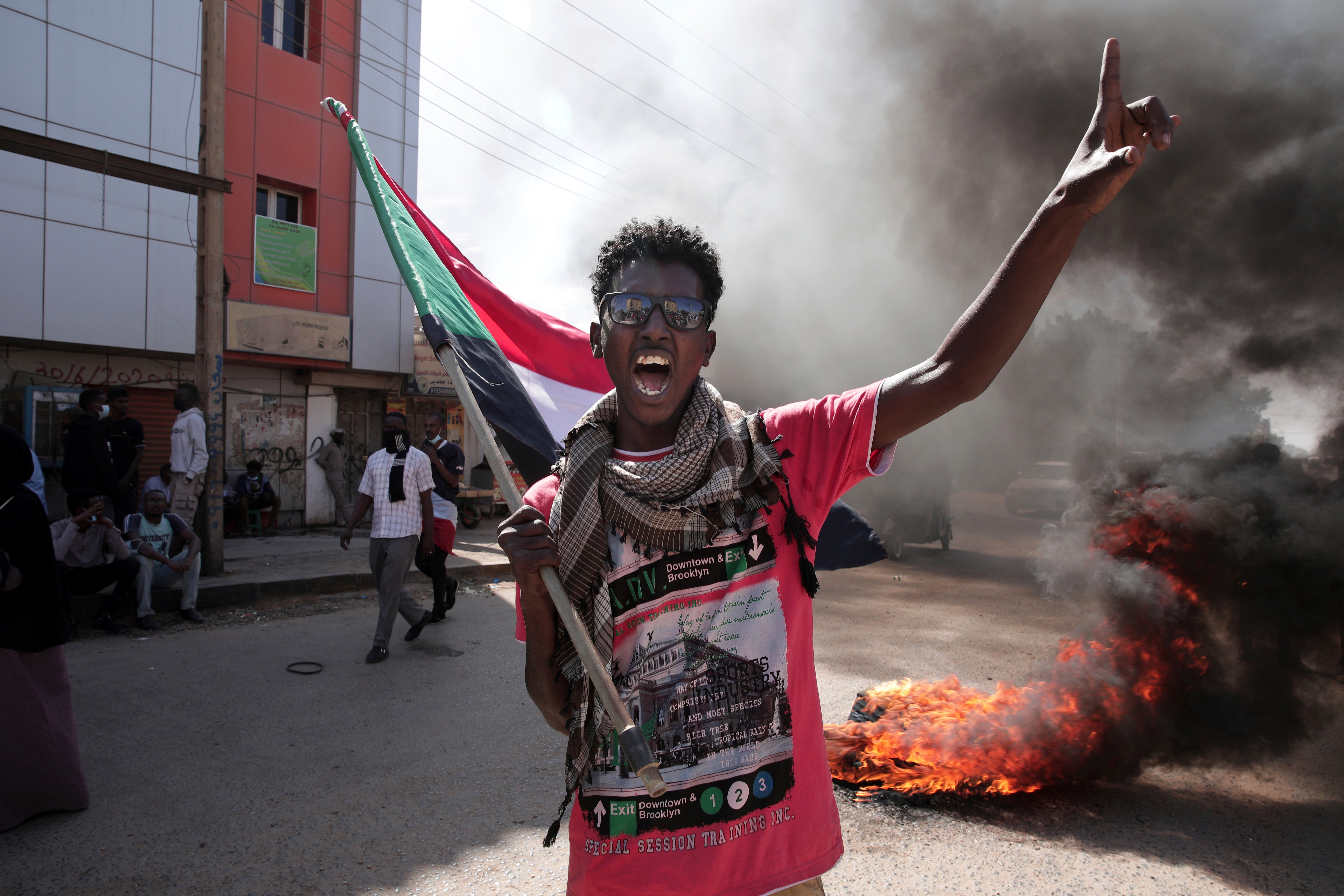 A man chants slogans during a protest to denounce the October military coup, in Khartoum, Sudan, 25 December 2021