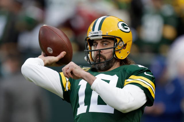 Green Bay Packers’ Aaron Rodgers warms up before an NFL football game against the Cleveland Browns (Matt Ludtke/AP)