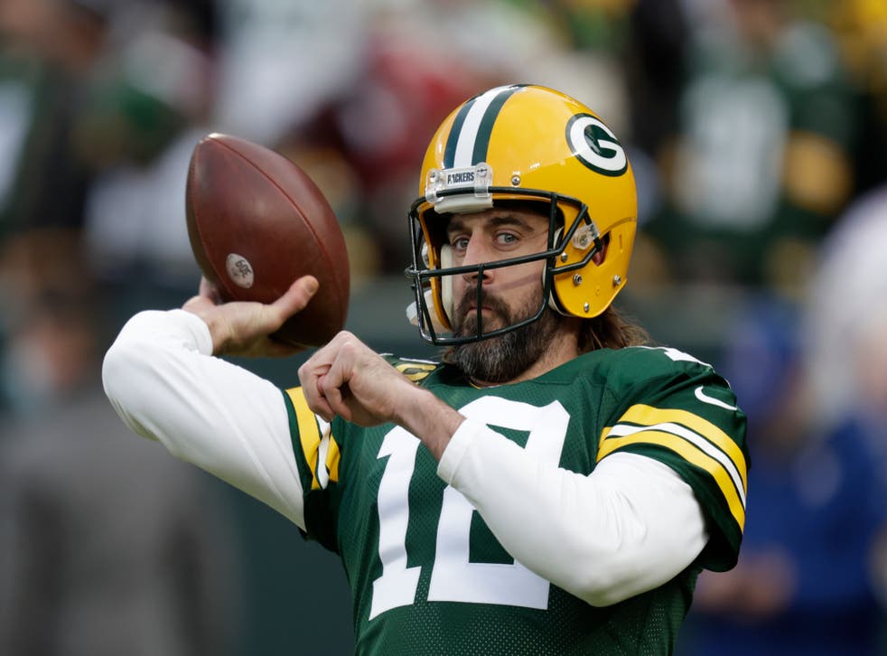 Green Bay Packers’ Aaron Rodgers warms up before an NFL football game against the Cleveland Browns (Matt Ludtke/AP)