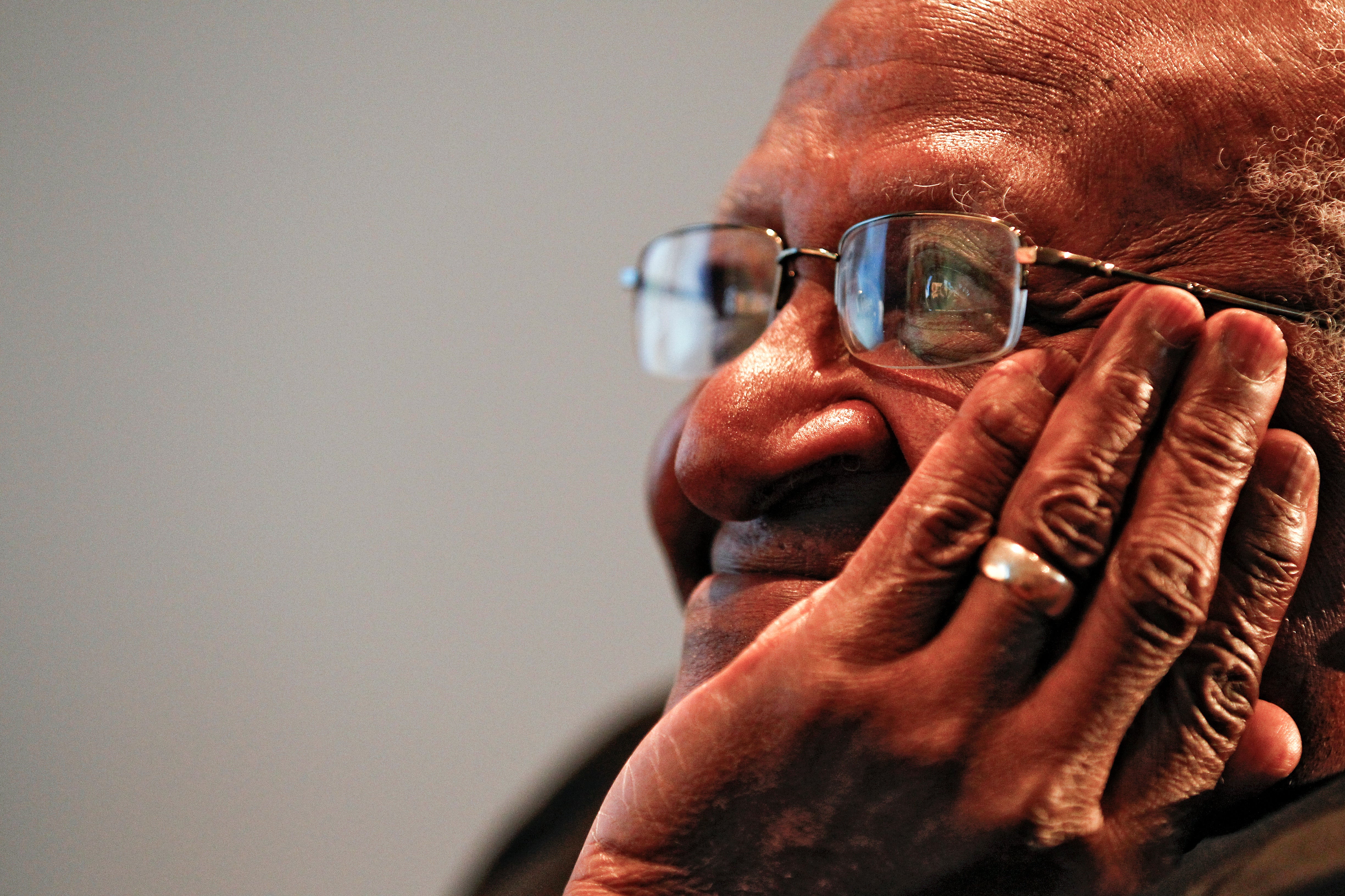 File photo: Archbishop Desmond Tutu listens to speeches at at event in Cape Town, South Africa, 30 July 2010
