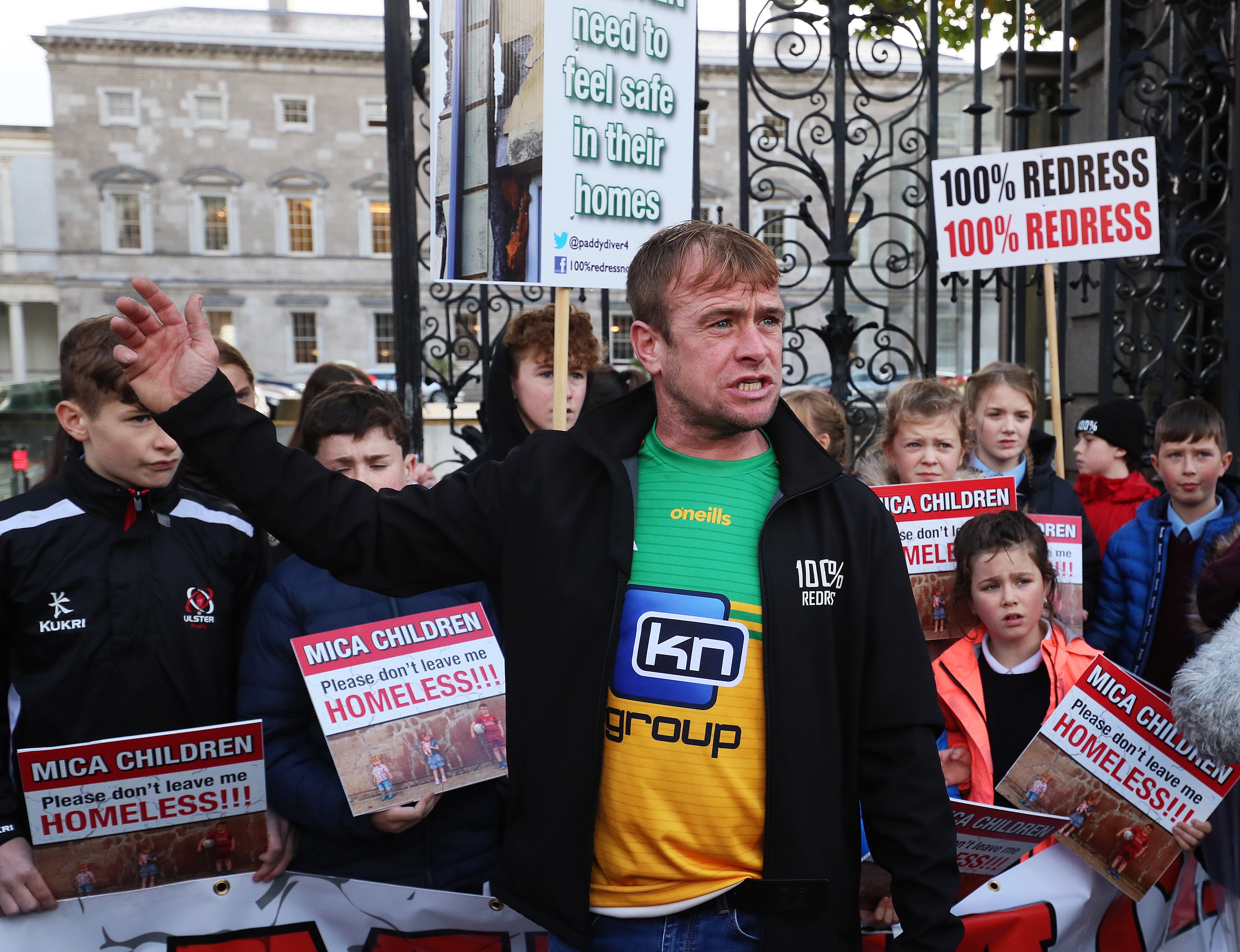 Mica activist Paddy Diver joins children from across Donegal at the gates of the Dail in Dublin (Brian Lawless/PA)