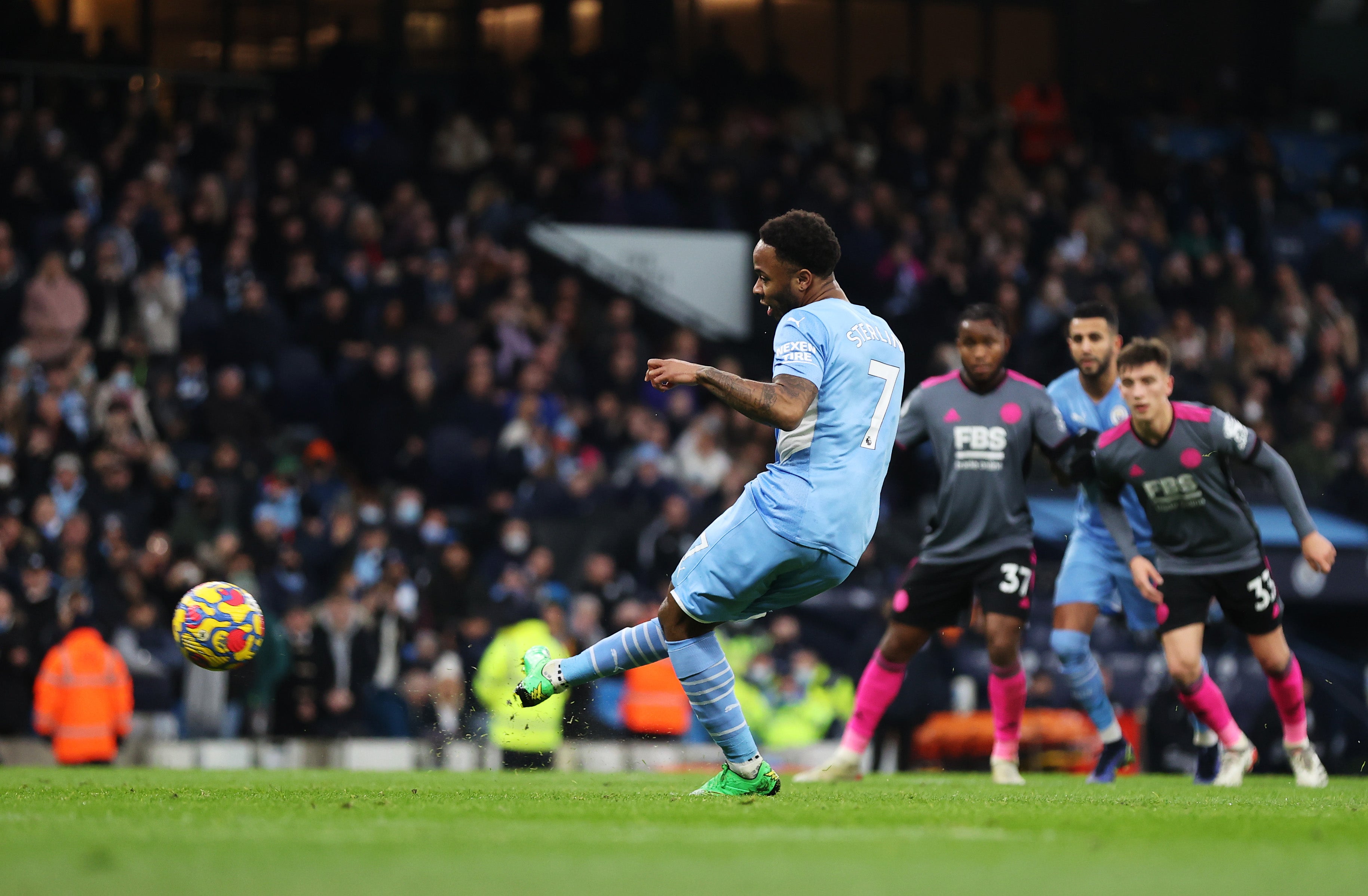 Raheem Sterling converts from the spot after winning Man City’s second penalty