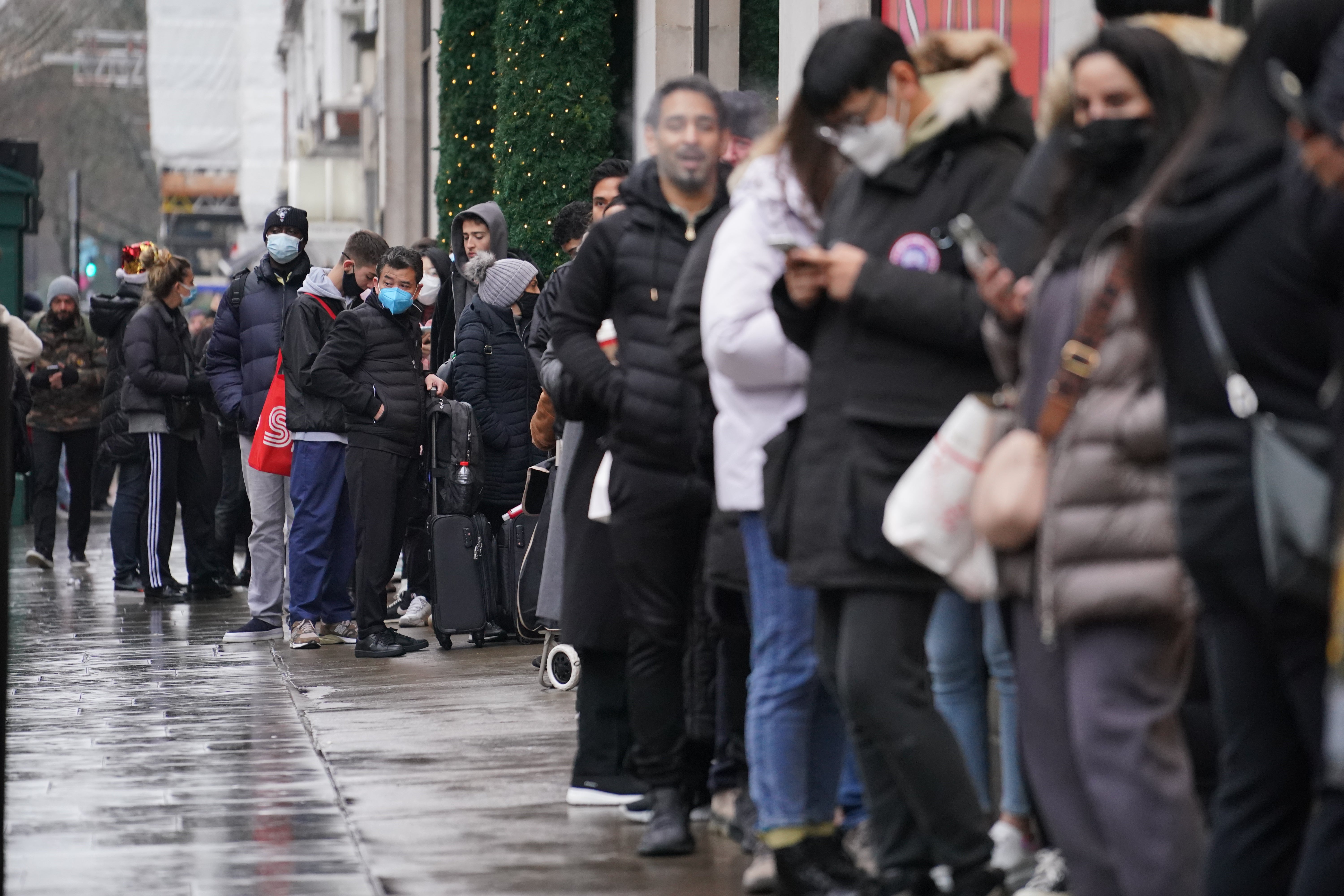 Shoppers stand in line for the doors to open for the start of the Boxing Day sales at Selfridges department store on Oxford Street in London (Jonathan Brady/PA)