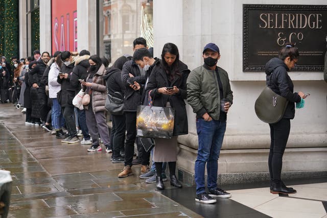 Shoppers stand in a queue for the doors to open for the start of the Boxing Day sales at Selfridges department store on Oxford Street (Jonathan Brady/PA)