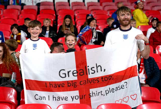 England fans hold up a banner asking for Jack Grealish’s shirt (Nick Potts/PA)