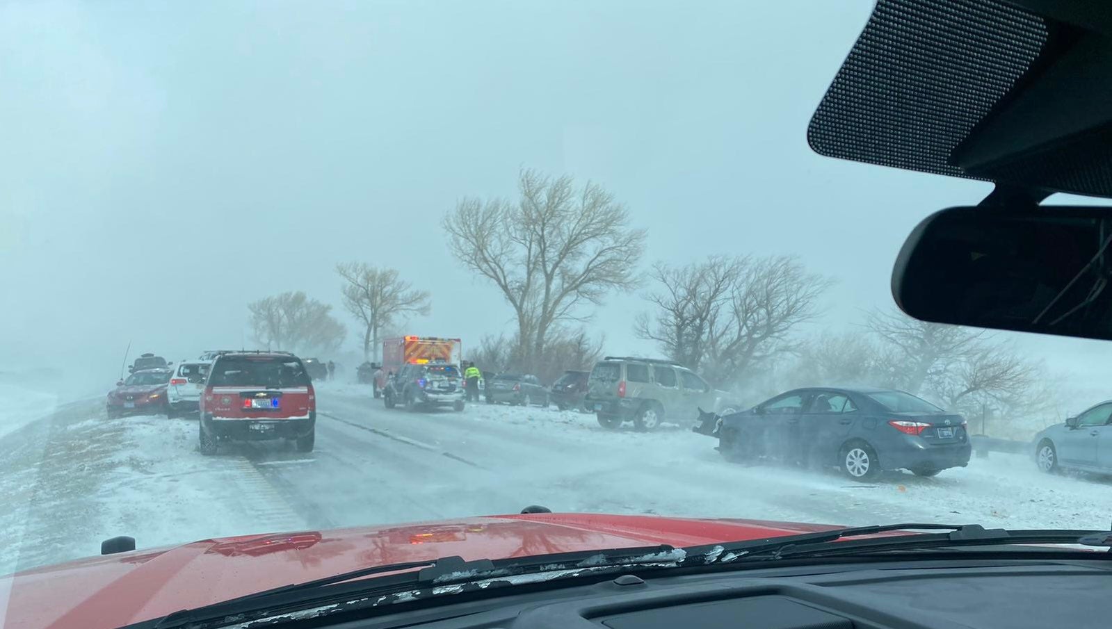 Authorities responded to a 20-car pileup in the outskirts of Reno as white-out conditions led to a storm and the closure of key highways