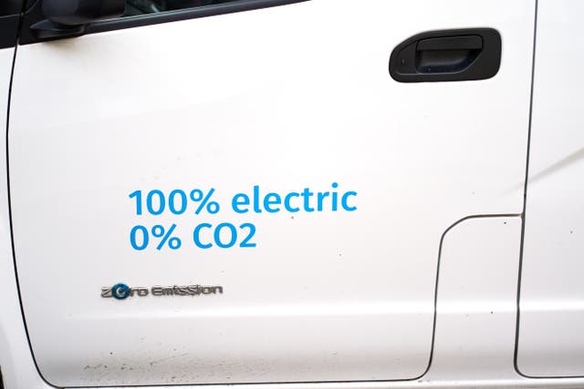 Signage on the side of a 100% electric van (John Walton/PA)