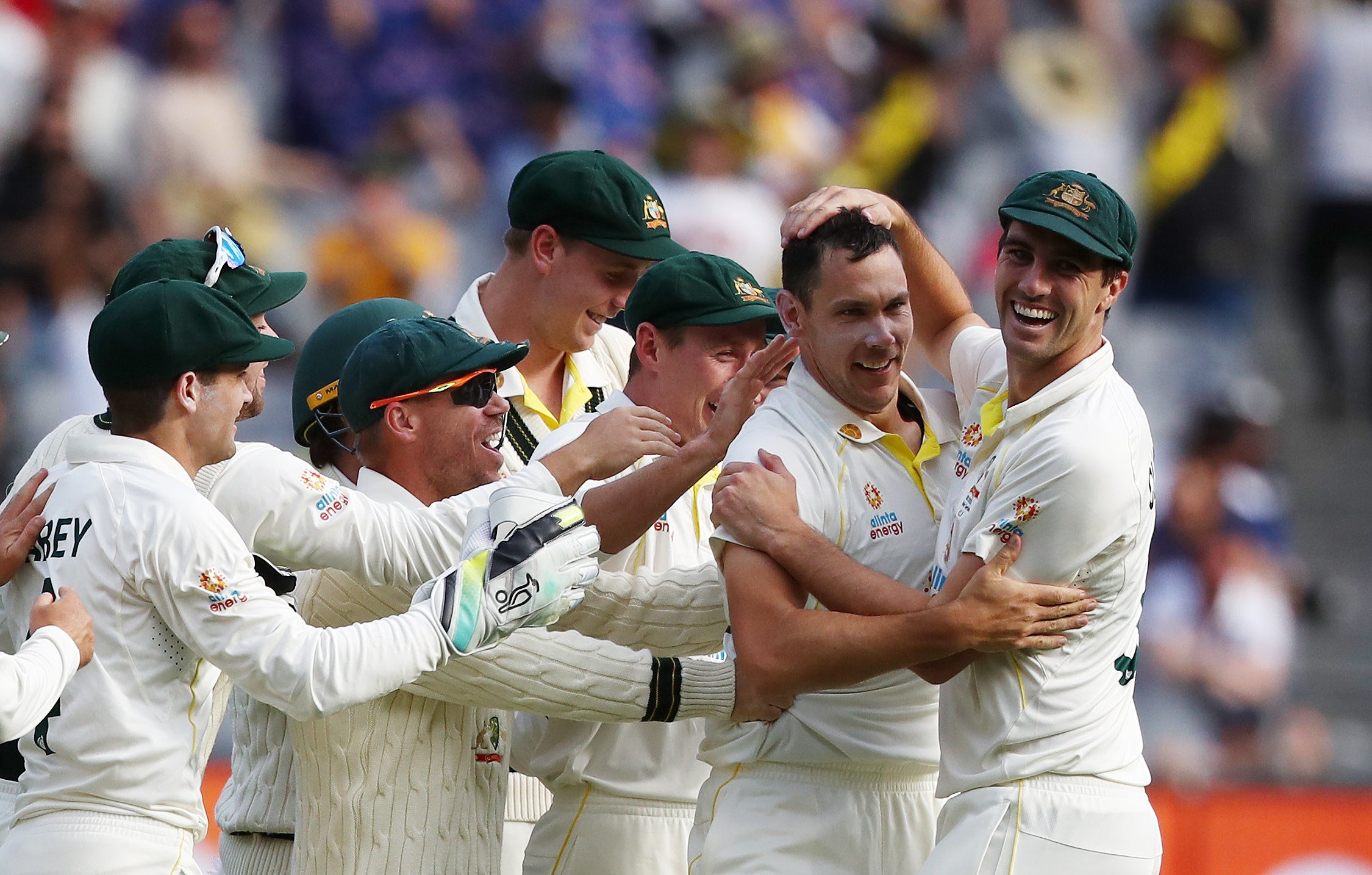 Australia mobbed Scott Boland after he delivered the fourth wicket of a short new-ball session (Jason O’Brien/PA)