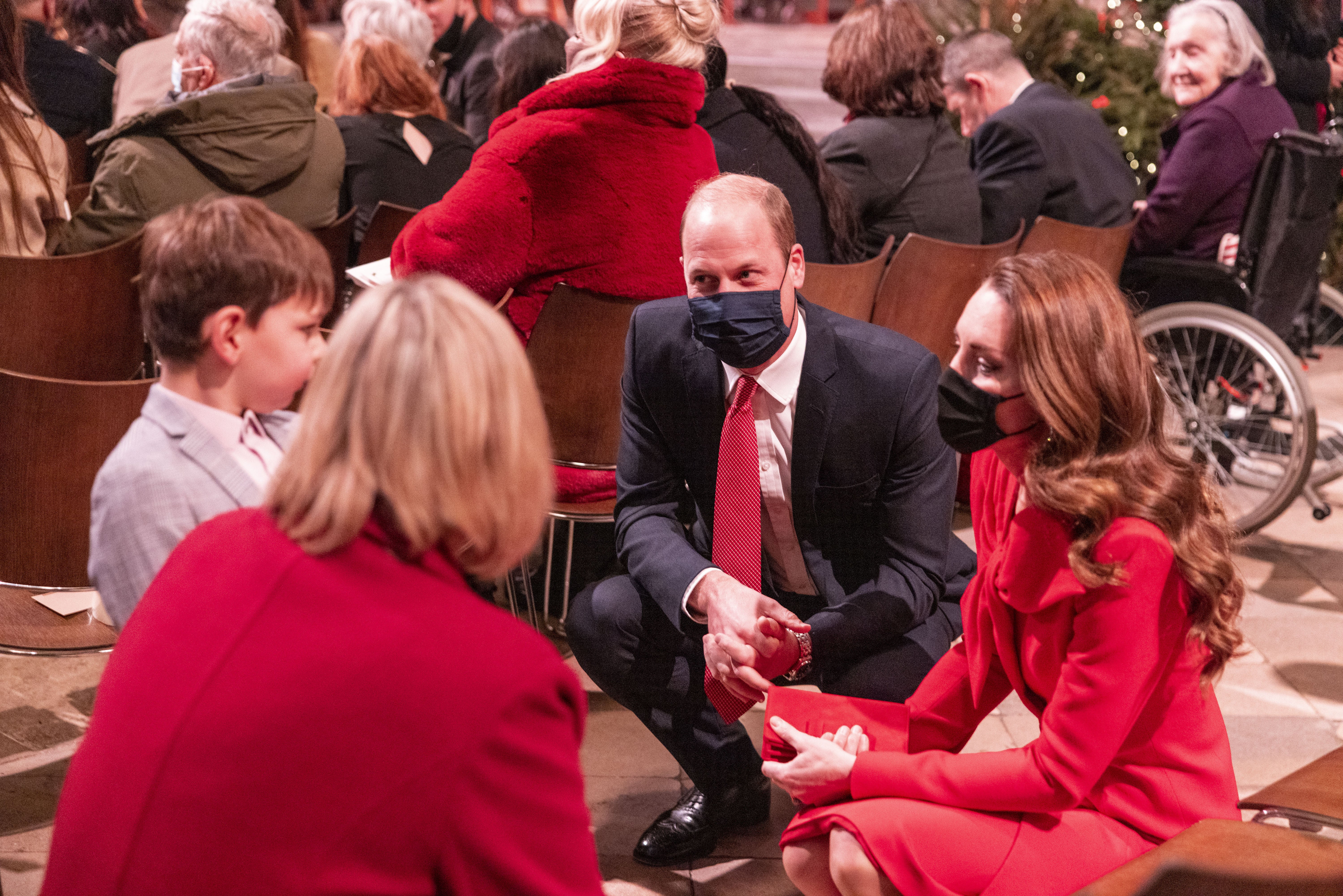 The Duke and Duchess of Cambridge talk to participants ahead of the Together At Christmas community carol service at Westminster Abbey in London, in December (Heathcliff O’Malley/PA)