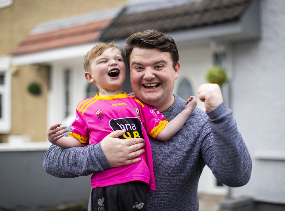 Four-year-old Daithi MacGabhann with his dad Mairtin MacGabhann at their home in Belfast (Liam McBurney/PA)