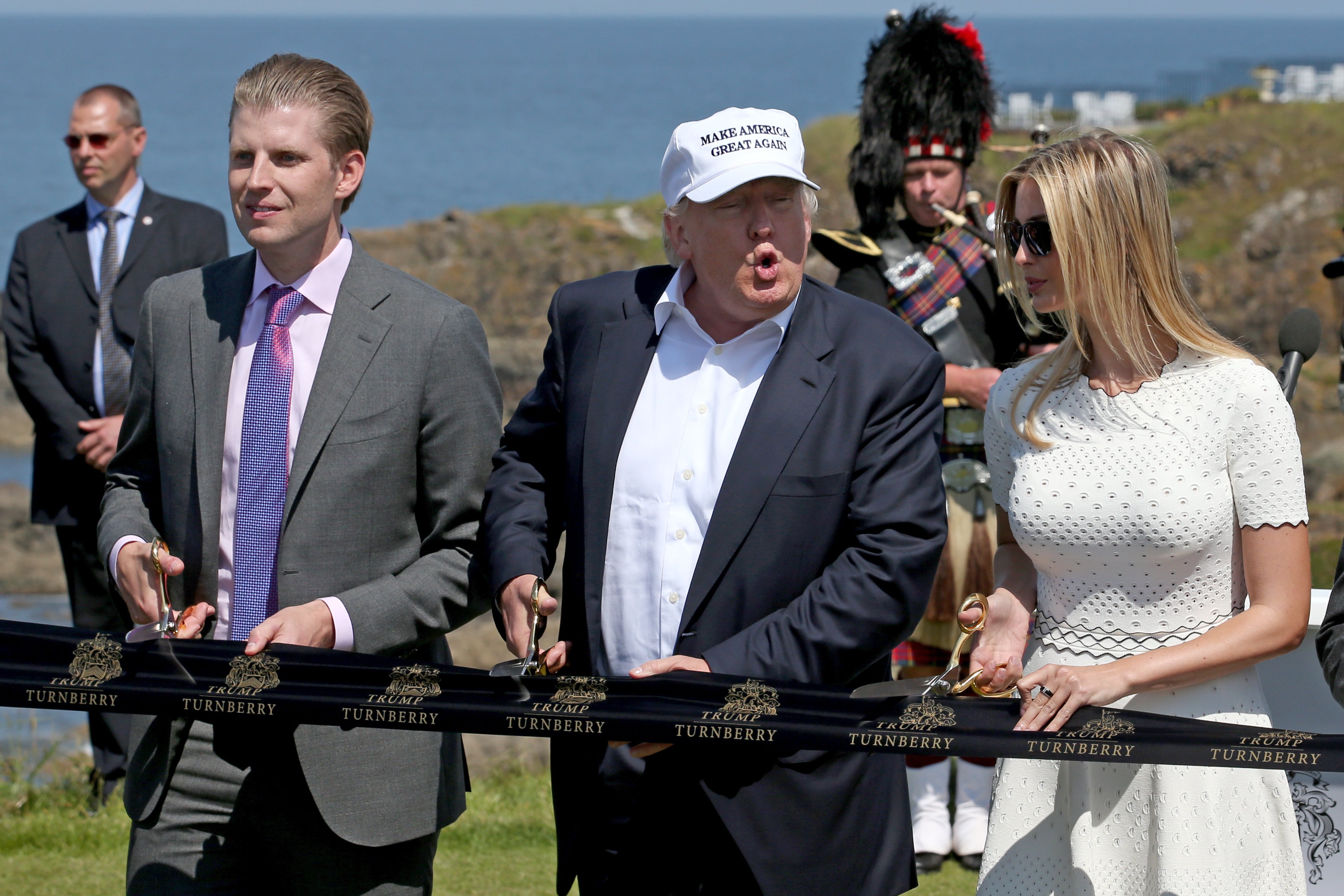 Donald Trump, with his daughter Ivanka and son Eric, reopening a revamped Turnberry (Jane Barlow/PA)