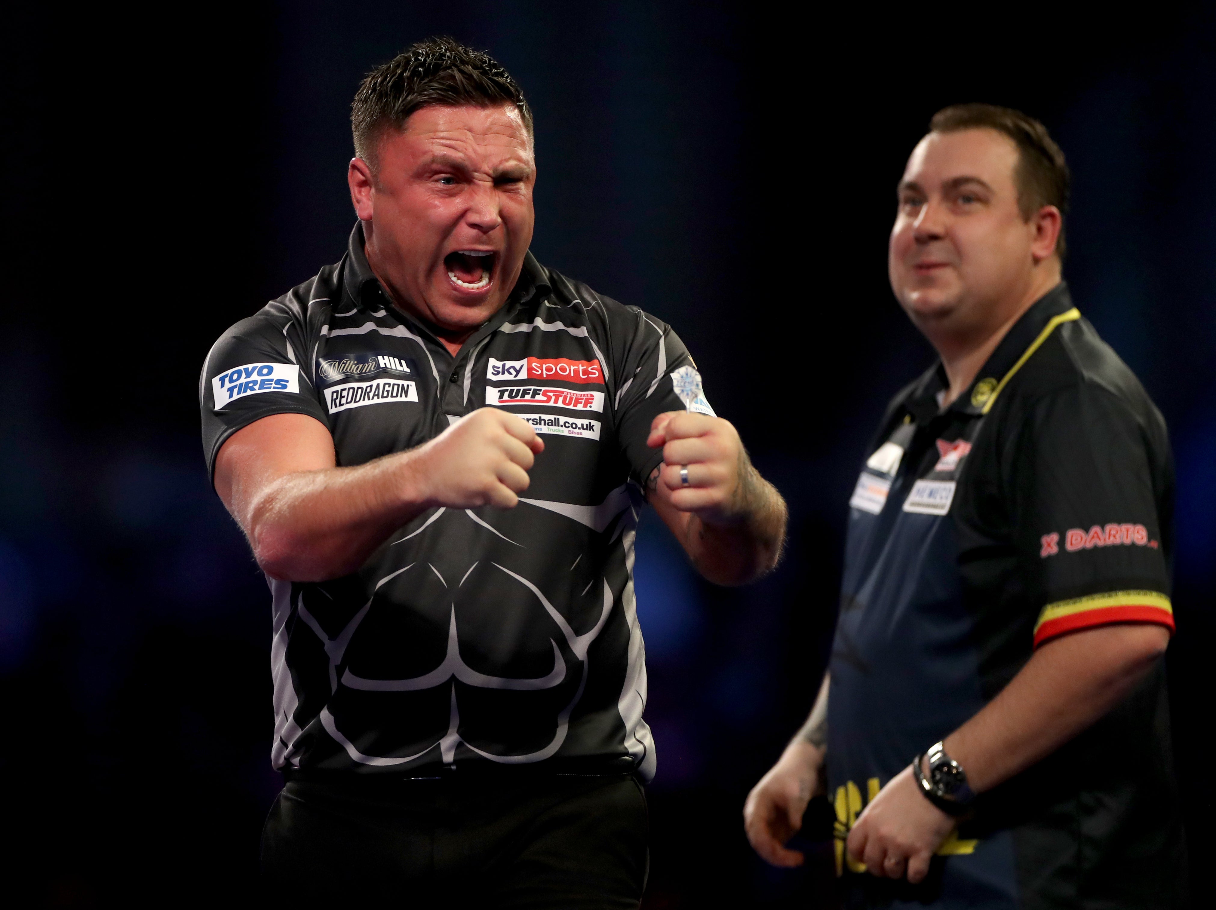 Gerwyn Price edged out Kim Huybrechts in a tense contest on Monday night (Bradley Collyer/PA)