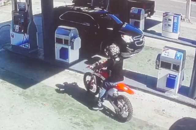 <p>Screengrab of the CCTV footage that shows the teen entering a gas station moments before the crash</p>