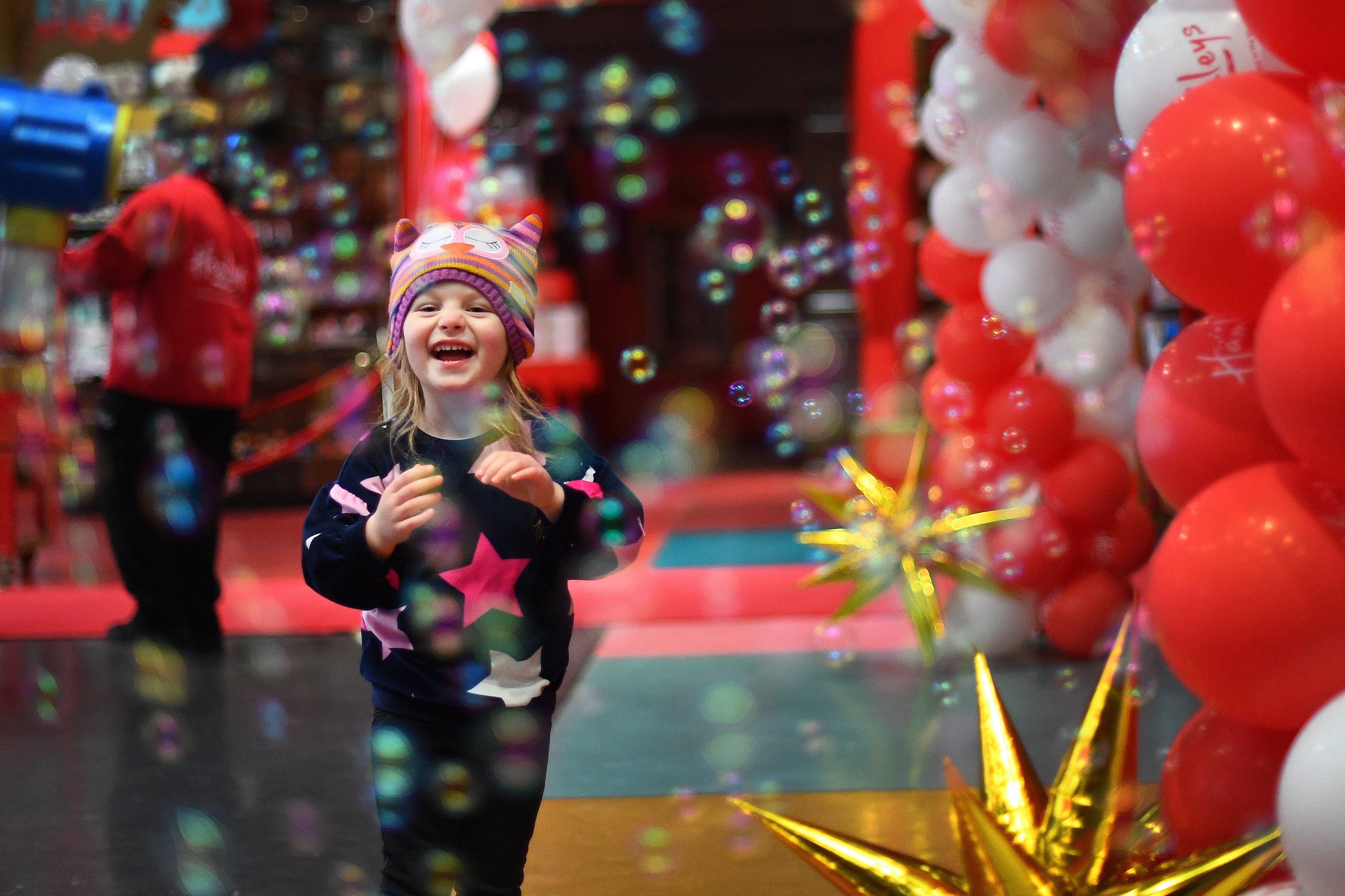The joy is etched on the face of Nevaeah Peeble as Hamleys toy shop on London’s Regent Street reopened (Victoria Jones/PA)