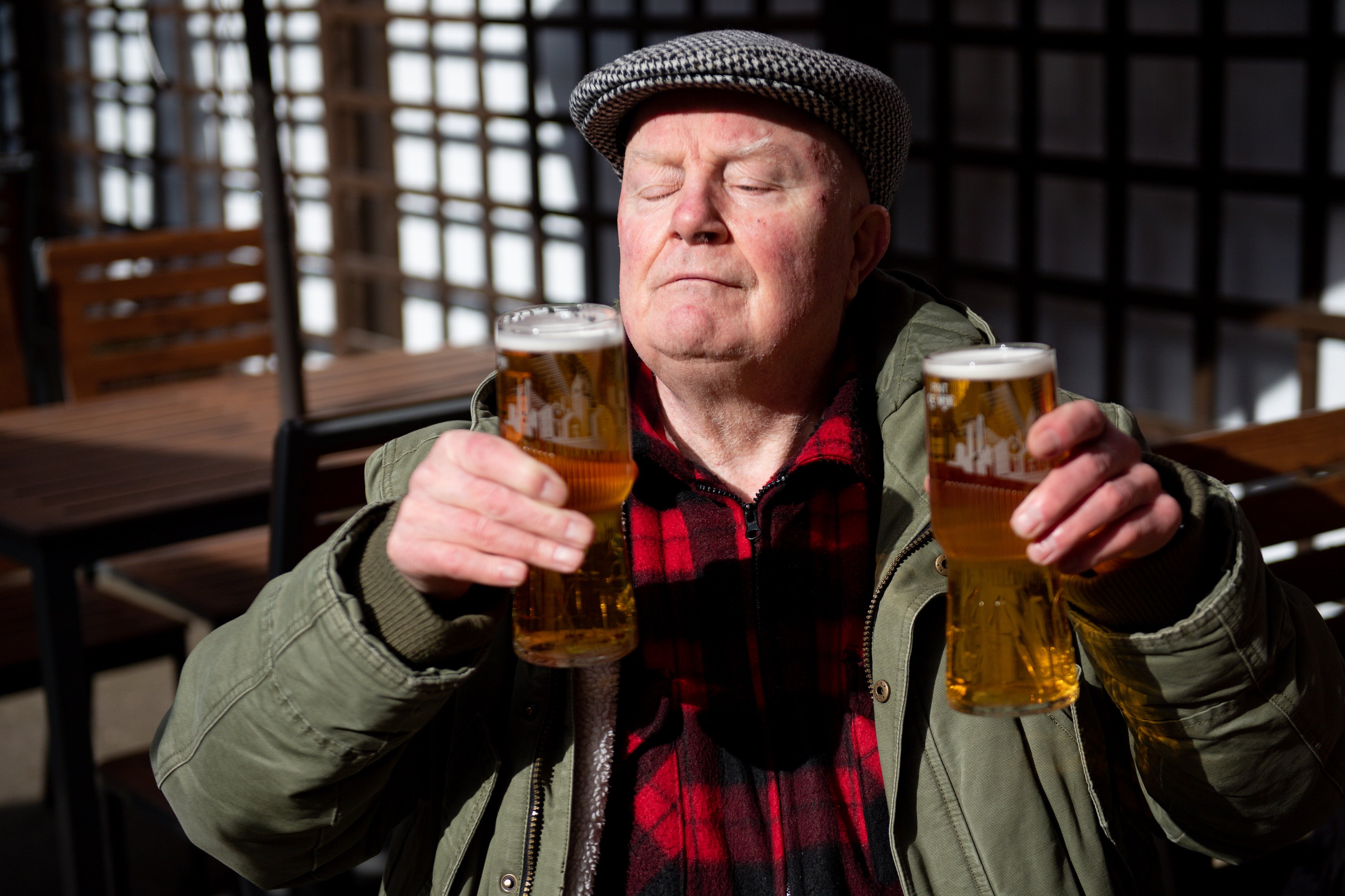 John Witts enjoys a drink at the reopening of the Figure of Eight pub in Birmingham (Jacob King/PA)
