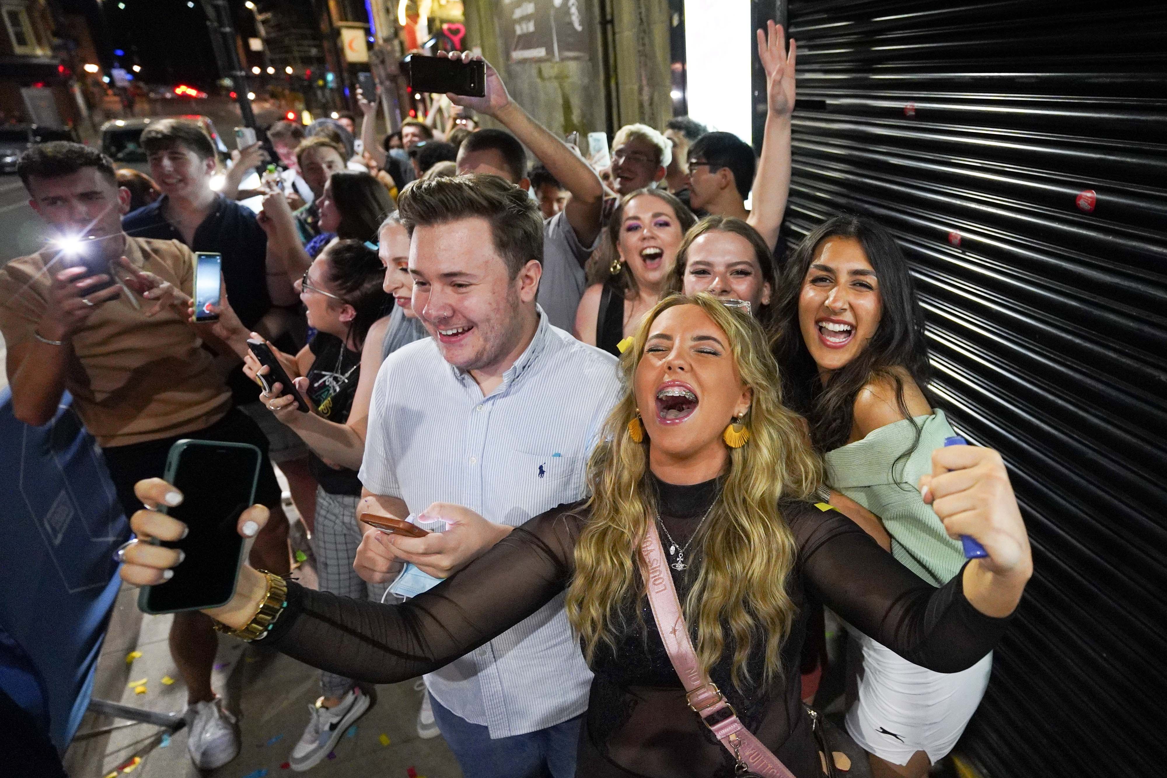 Nightclub revellers were unable to contain their glee as the final restrictions were lifted (Ioannis Alexopoulos/PA)