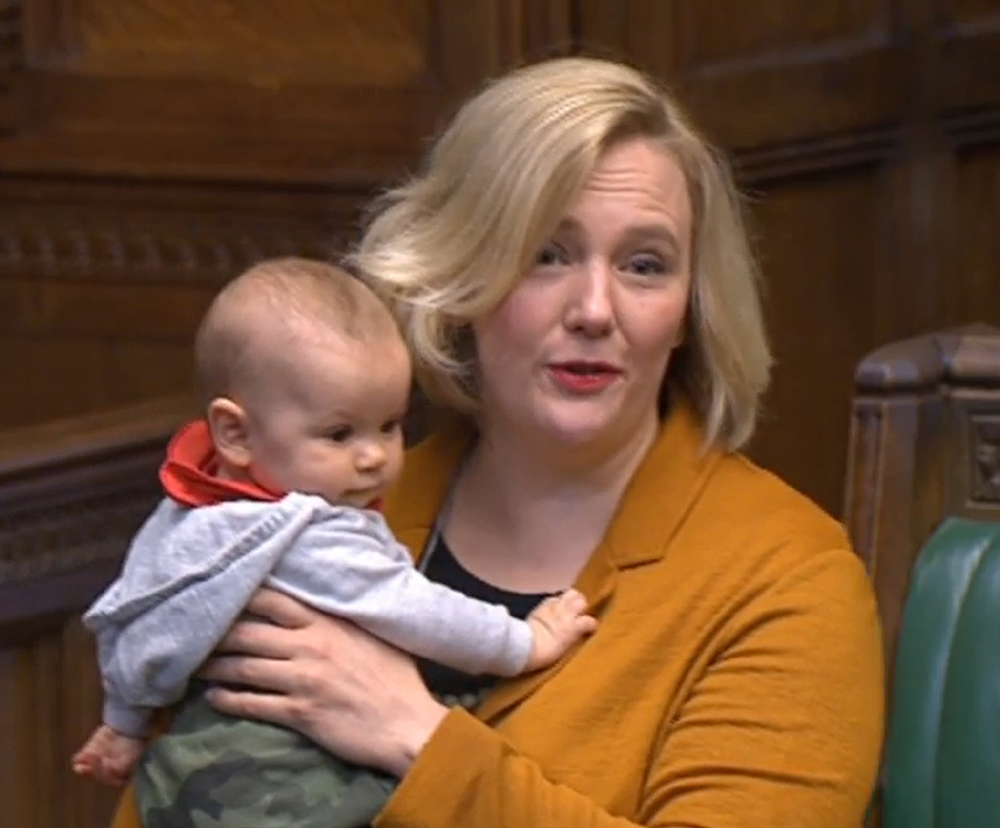 Labour MP Stella Creasy holds her baby daughter in the House of Commons