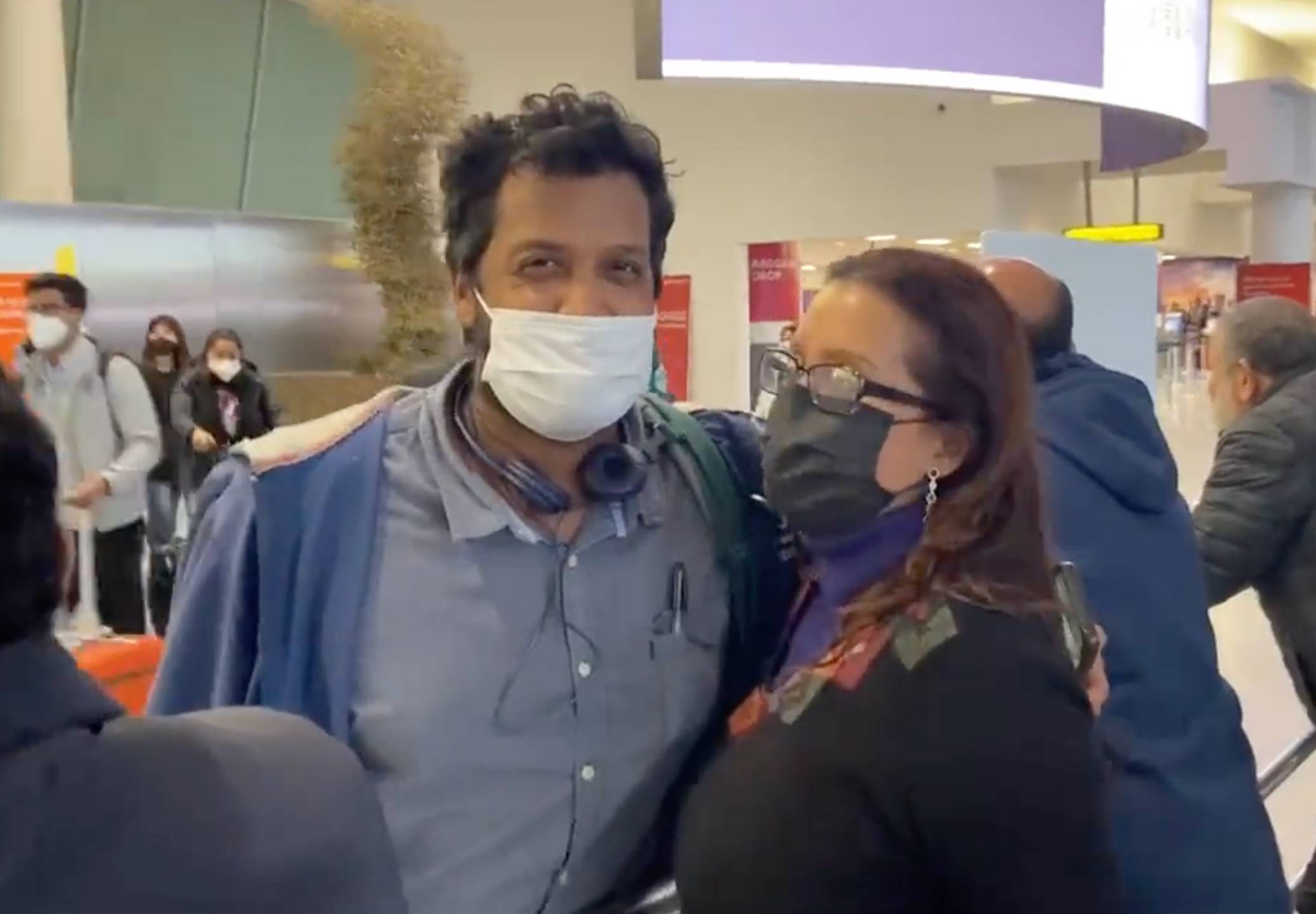<p>Fernando Espinoza hugs his mother Sara at JFK International Airport on December 27, 2021</p>