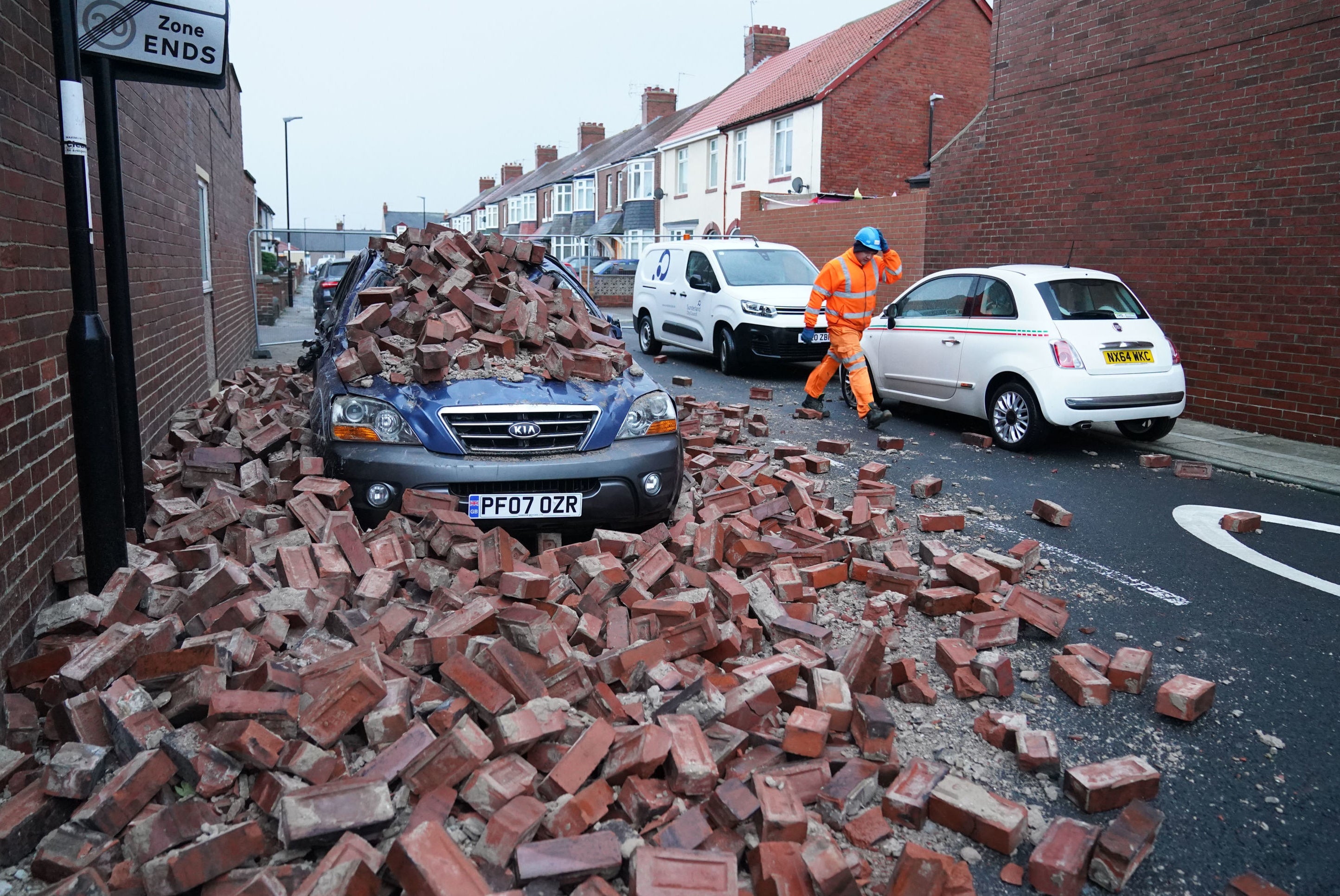 A wall which fell and damaged a car during Storm Arwen which battered the UK