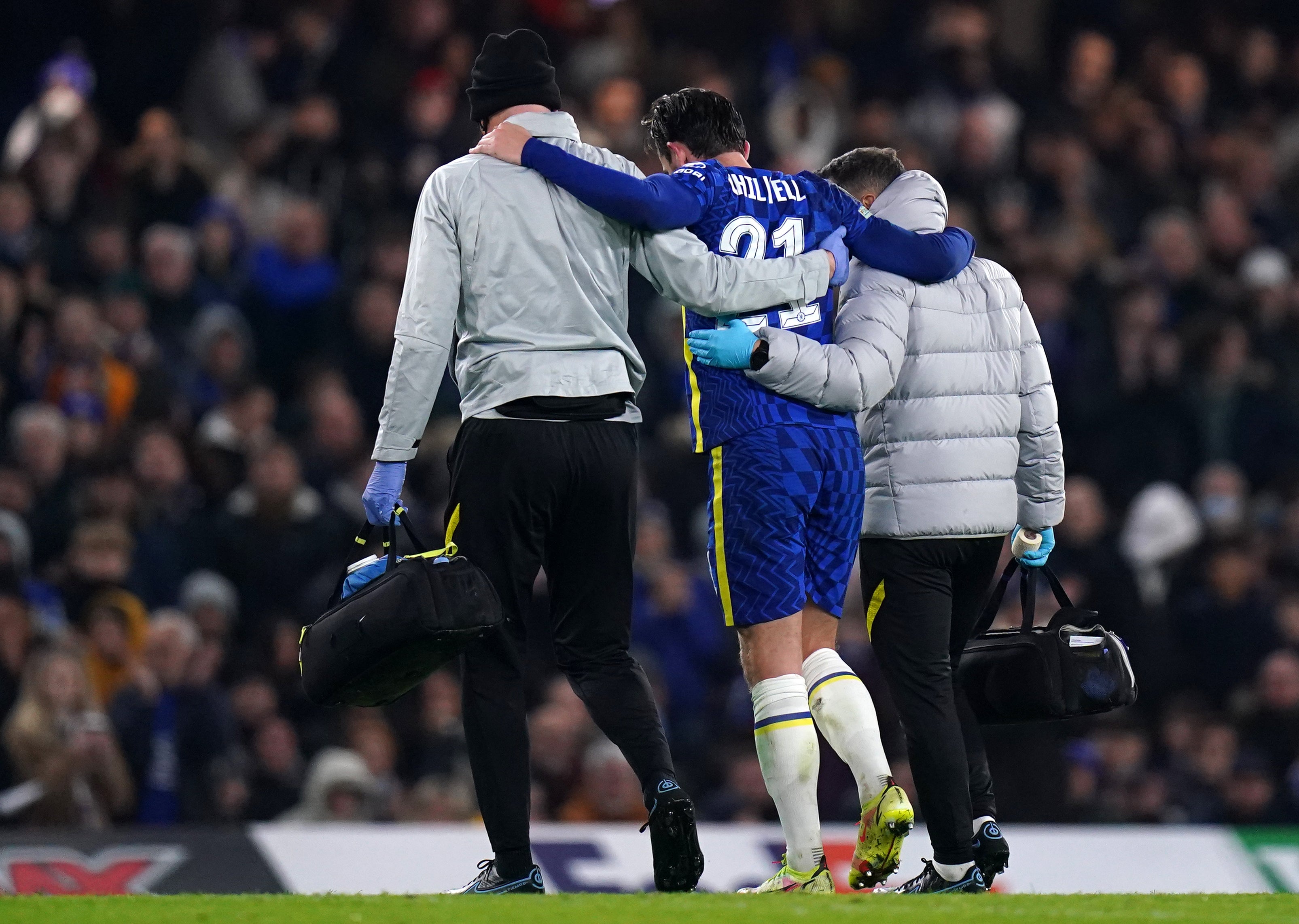 Ben Chilwell, centre, is helped off the pitch after suffering his knee injury against Juventus (Adam Davy/PA)