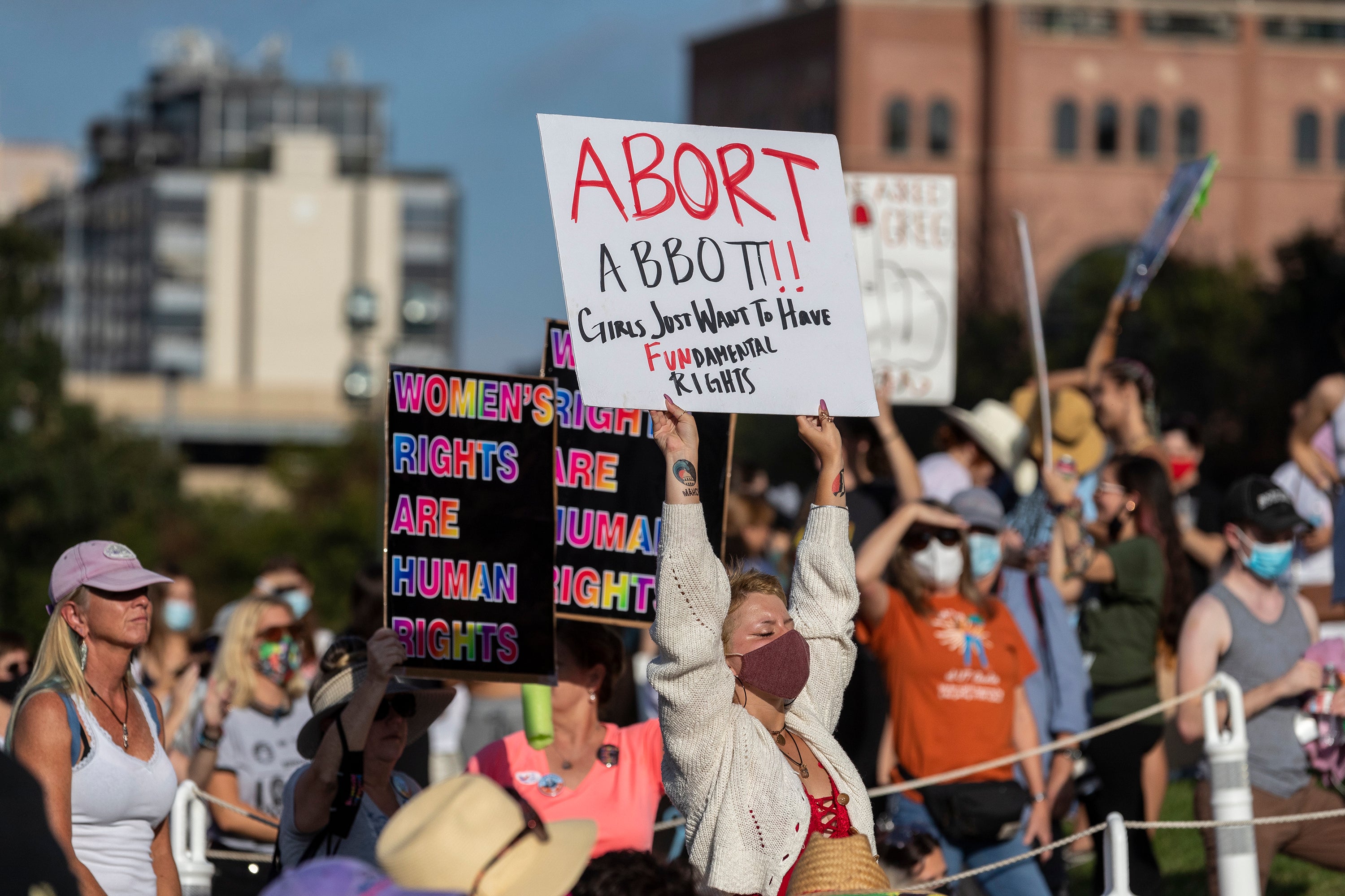 People attend the Women's March ATX rally, Saturday, Oct., 2, 2021, at the Texas State Capitol in Austin, Texas. An expected decision by the U.S. Supreme Court in the coming year to severely restrict abortion rights or overturn Roe v. Wade entirely is setting off a renewed round of abortion battles in state legislatures. (AP Photo/Stephen Spillman, File)