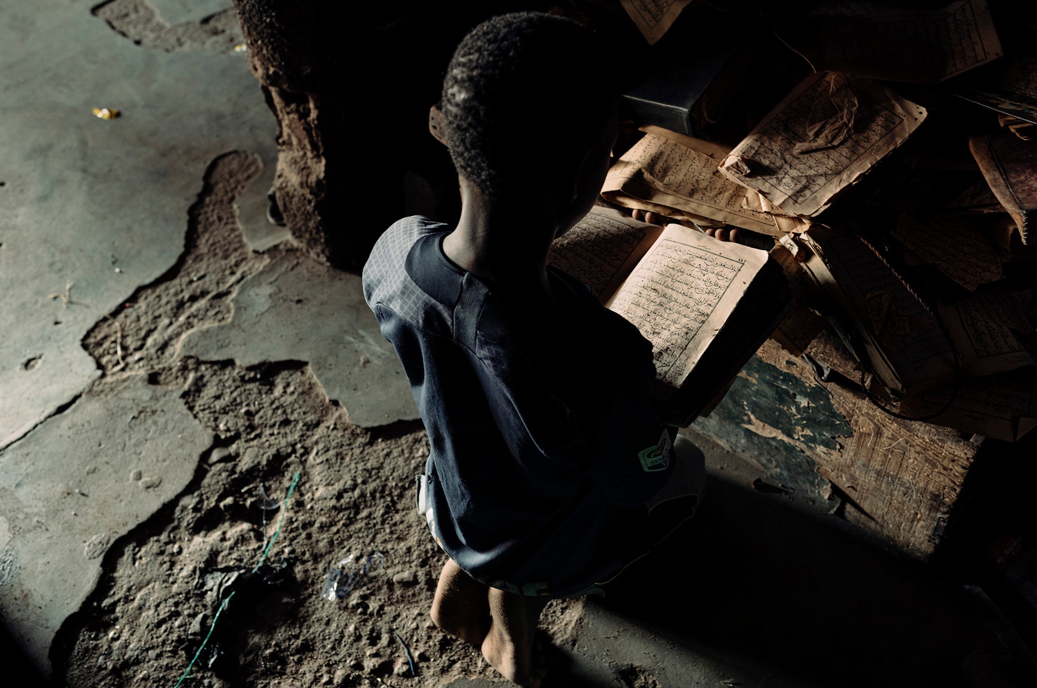 A young boy at an unregistered religious based school in Mali used as a front for a begging gang