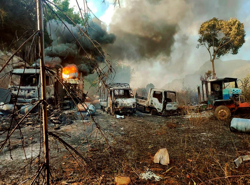 <p>Photos have spread online, showing the charred bodies of over 30 people in three burned-out vehicles</p>