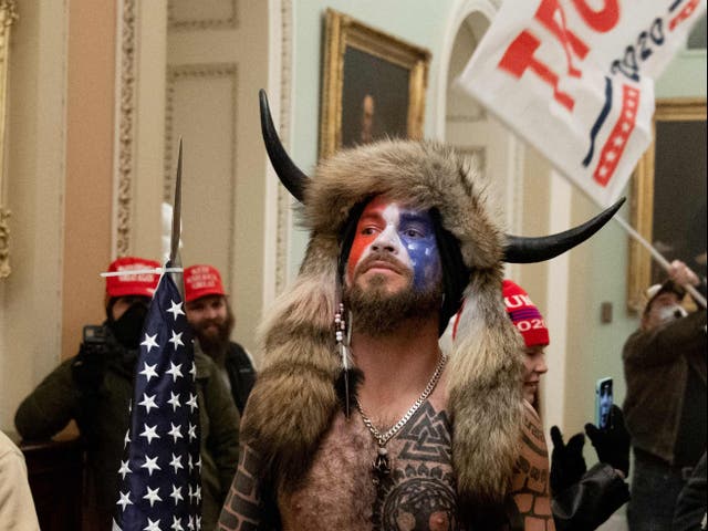 <p>Jacob Chansley, the ‘QAnon Shaman’, in the US Capitol on 6 January 2021</p>