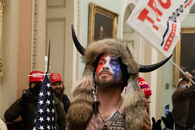 <p>Jacob Chansley, the ‘QAnon Shaman’, in the US Capitol on 6 January 2021</p>