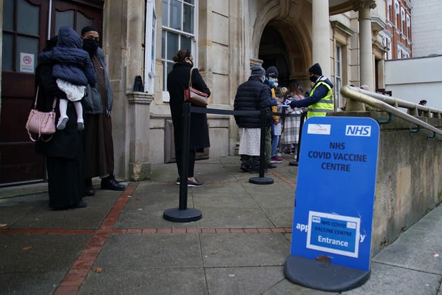 The NHS is mounting a fresh drive to get Covid booster jabs into arms to protect against the fast-spreading Omicron variant (Gareth Fuller/PA)