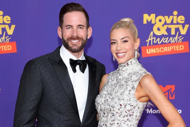 <p>Tarek El Moussa and Heather Rae Young attend the 2021 MTV Movie & TV Awards: UNSCRIPTED in Los Angeles, California</p>