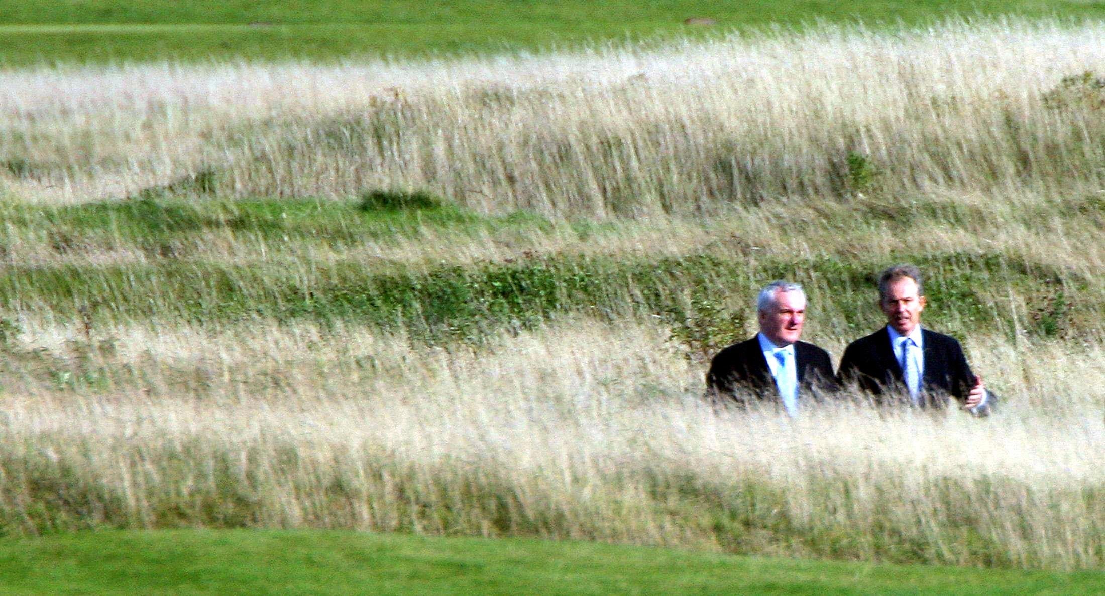 British prime minister Tony Blair and Irish taoiseach Bertie Ahern on the golf course at the Fairmont Hotel in St Andrews, Scotland (Lewis Whyld/PA)