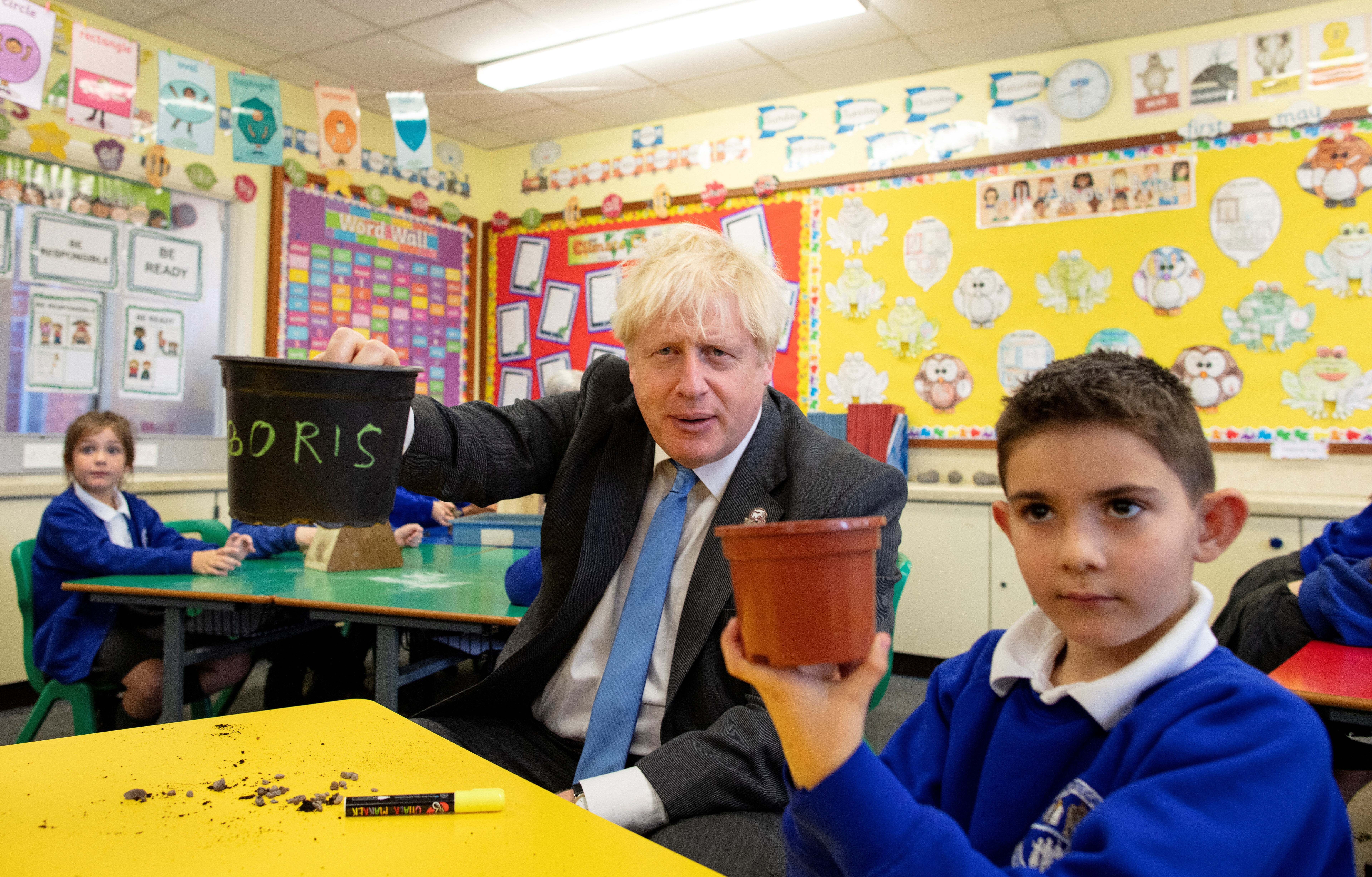 The princes were not the only dignitaries to visit Northern Ireland this year – Prime Minister Boris Johnson found time during the centenary events to join schoolchildren as they planted seeds during a visit to Crumlin Intergrated primary school in County Antrim in October (Paul Faith/PA)