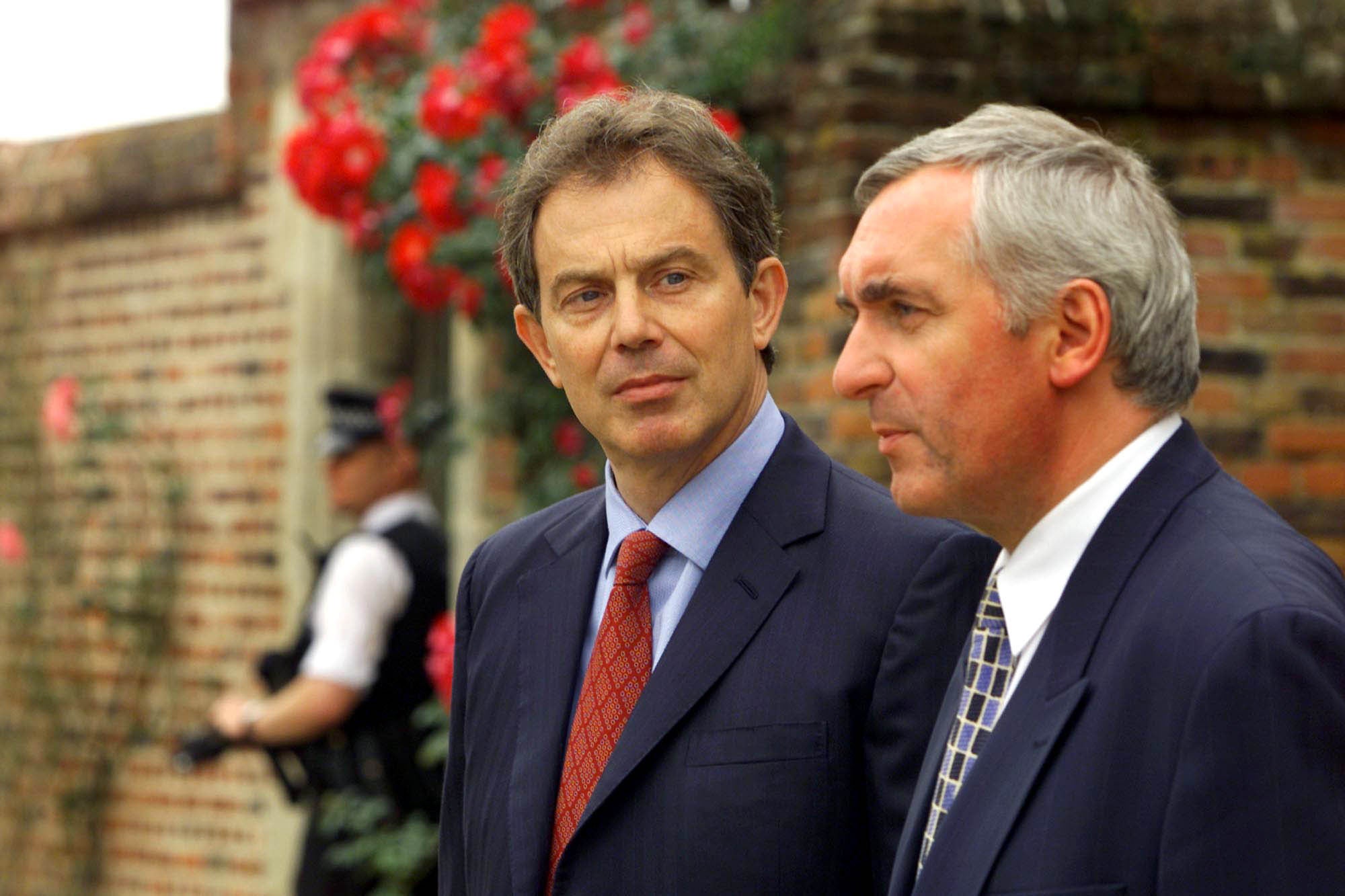 British prime minister Tony Blair, centre, and his Irish counterpart Bertie Ahern talk to the media at Chequers, near Aylesbury (PA Archive)