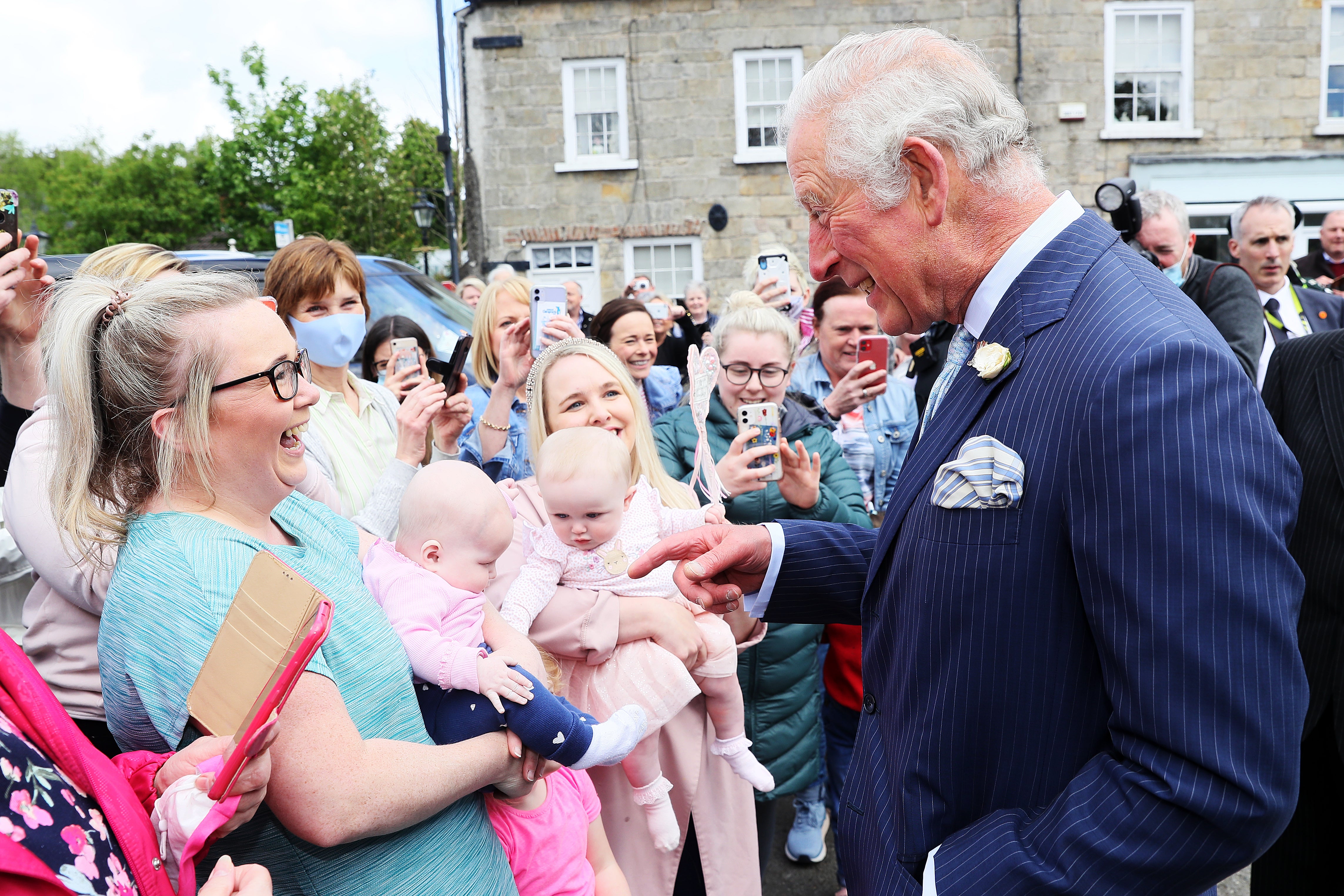 The Prince of Wales met Nicola Morton and her four-month-old daughter Evie (left) and Cathryn Grant and her seven-month-old daughter Sophia, during his visit to Caledon village in May (Brain Lawless/PA)