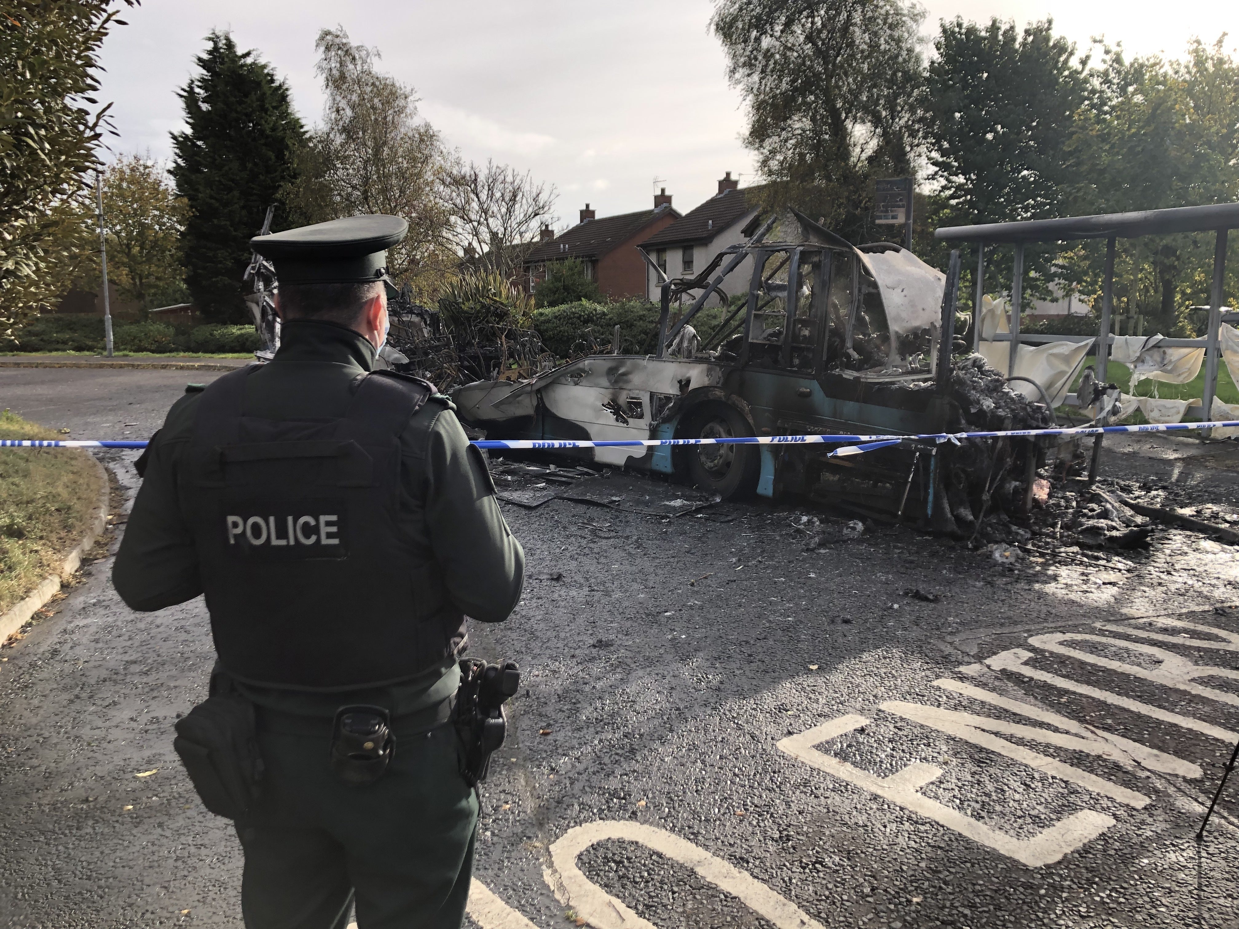 The scene on Abbott Drive in Newtownards near Belfast, after a bus was hijacked and set alight in an attack politicians have linked to loyalist opposition to Brexit’s Northern Ireland Protocol (David Young/PA)