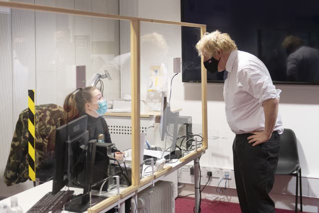 Boris Johnson during a visit to a Covid vaccination centre in Milton Keynes (Geoff Pugh/Daily Telegraph/PA)