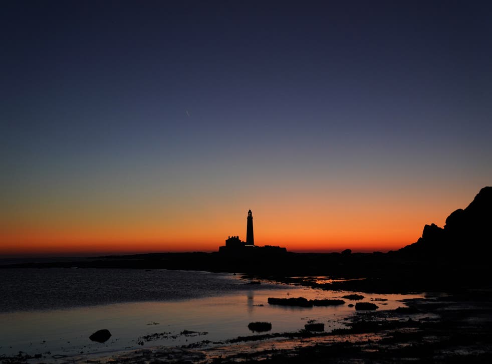 The blue hour before sunrise over St Mary’s Lighthouse in Whitley Bay off the North East coast. Picture date: Friday December 17, 2021.