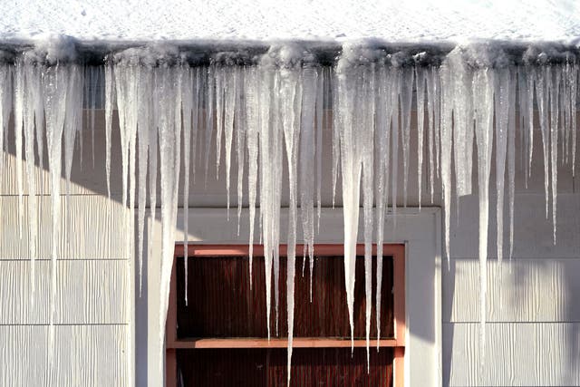 <p>Long icicles hang from a house where nearly a foot of snow fell over the weekend, on Monday, December 27, in Bellingham, Alaska</p>