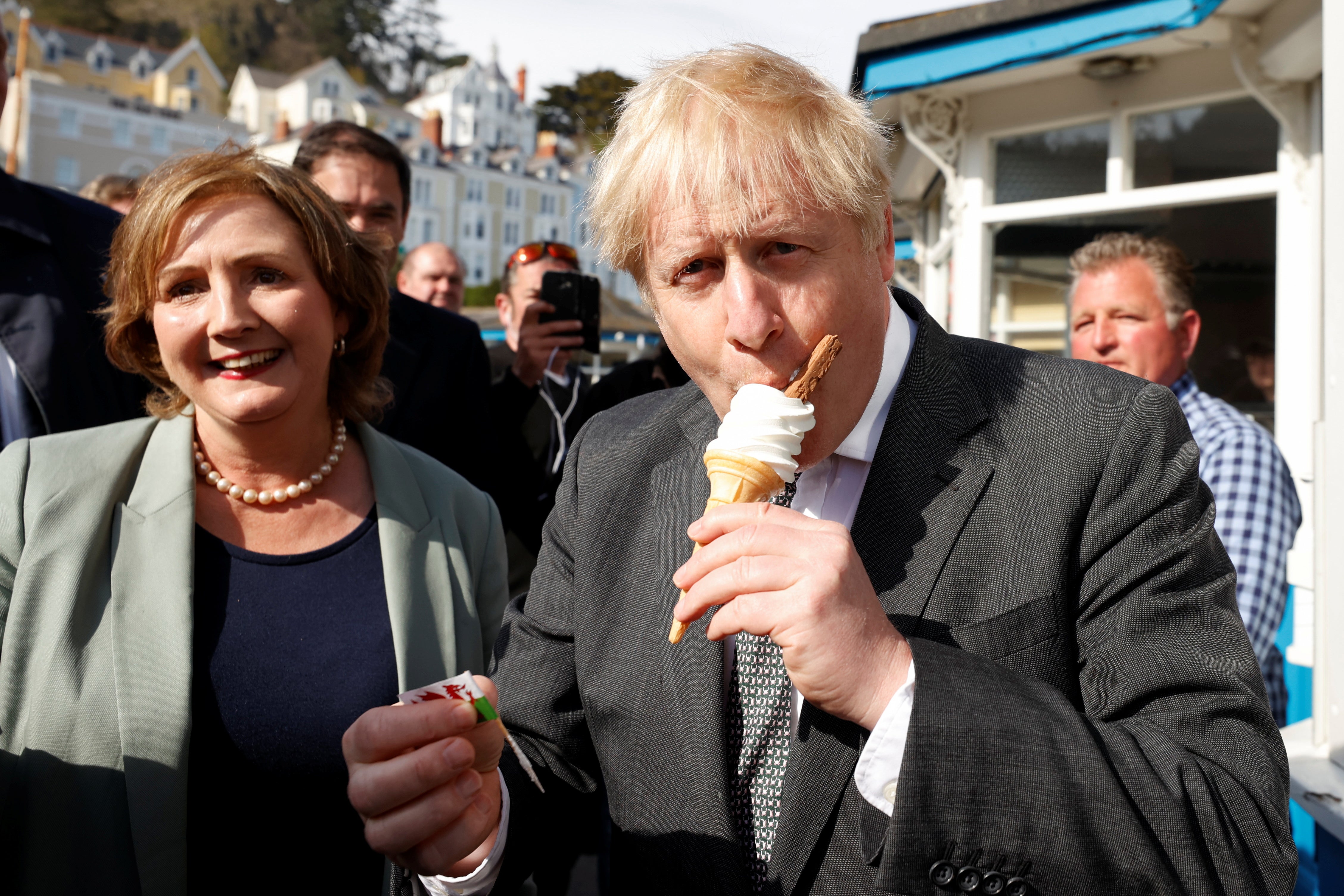 Prime Minister Boris Johnson eats an ice-cream during a visit to Llandudno (Phil Noble/PA)