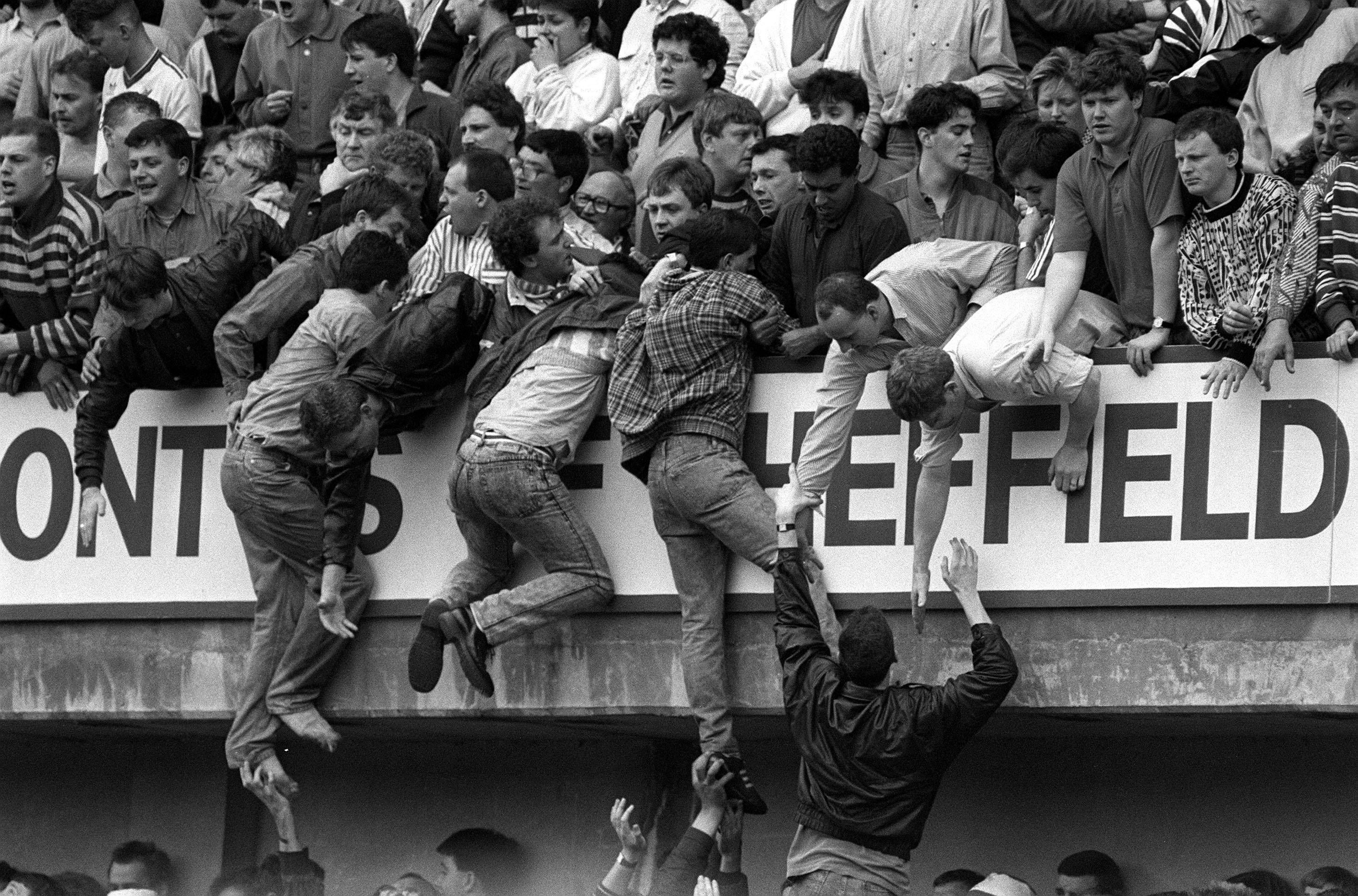 Liverpool fans at Hillsborough, trying to escape severe overcrowding during the FA Cup semi-final football match