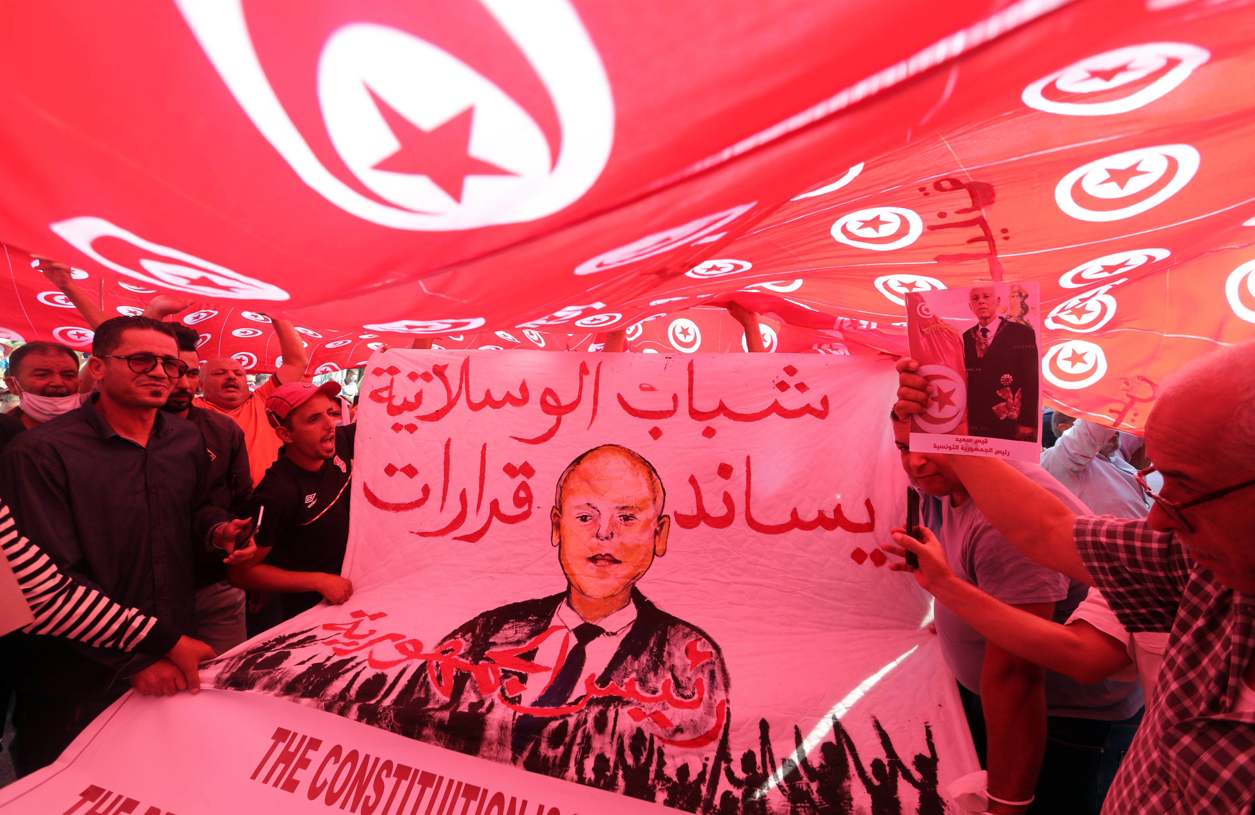 Supporters of Tunisian president Kais Saied rally in support of his seizure of power and suspension of parliament in Tunis, 3 October 2021