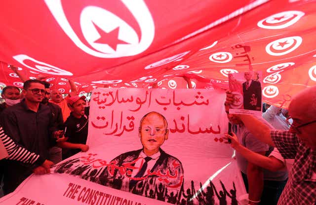 <p>Supporters of Tunisian president Kais Saied rally in support of his seizure of power and suspension of parliament in Tunis, 3 October 2021</p>