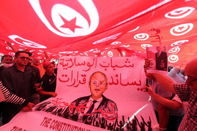 <p>Supporters of Tunisian president Kais Saied rally in support of his seizure of power and suspension of parliament in Tunis, 3 October 2021</p>