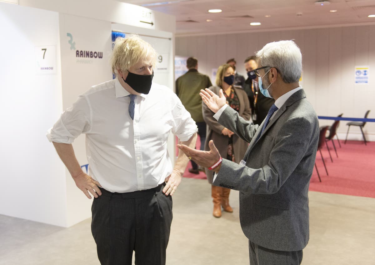 Johnson urges New Year partygoers to take Covid test despite shortage