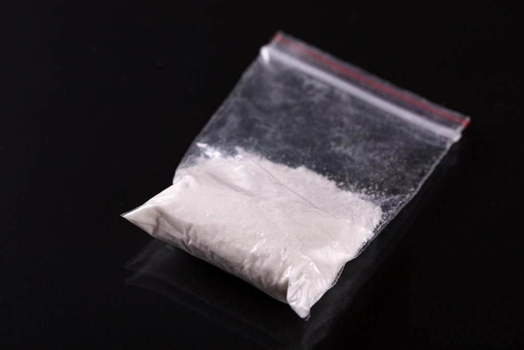 Man arrested after getting stuck in a bush with bag of cocaine on Christmas morning